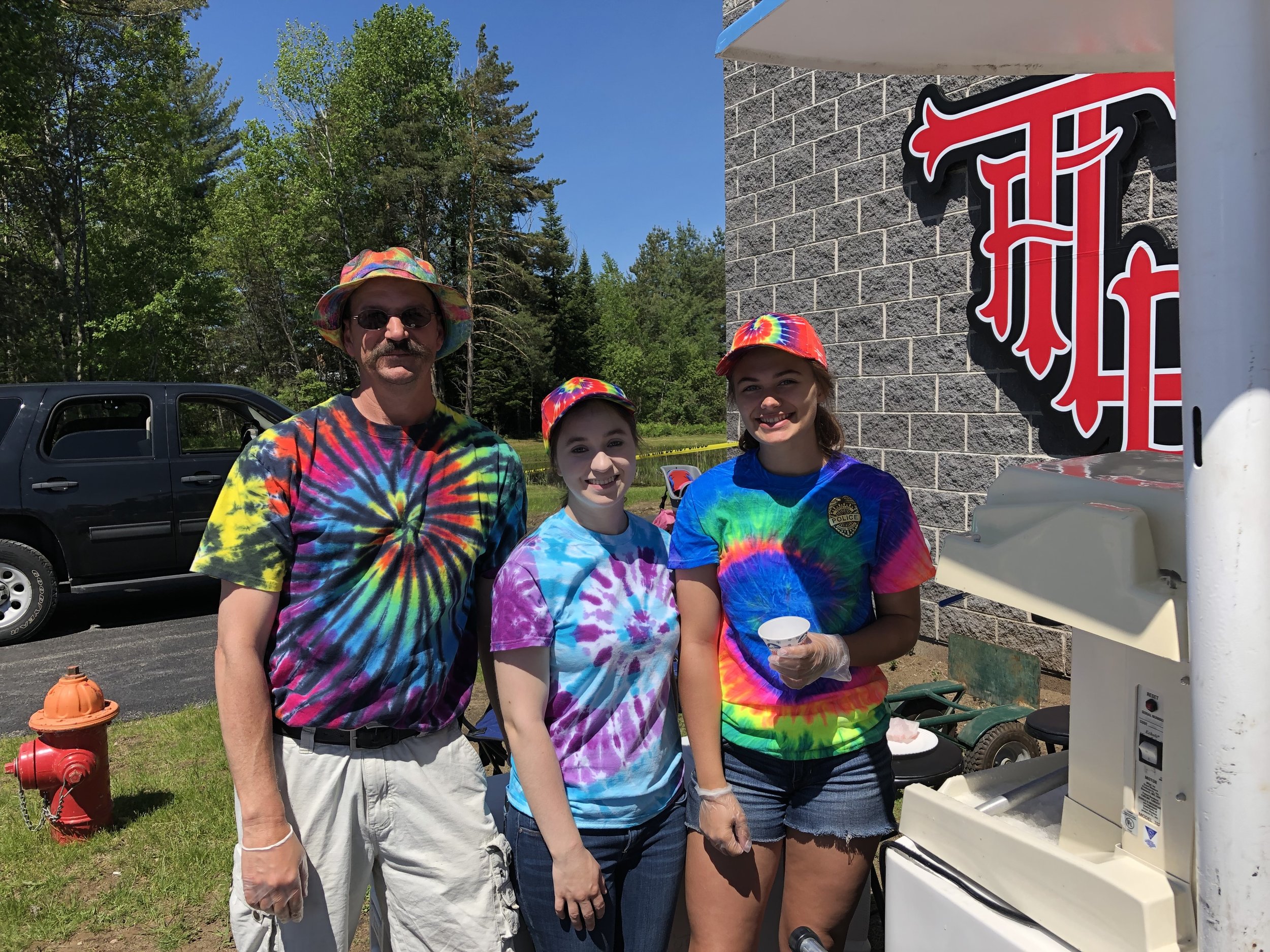   Carl Larson and his snow cone team Lindsay Remington and Rylie Fletcher kept their cool product flowing for thirsty bike riders. Over 375 cones they served.  