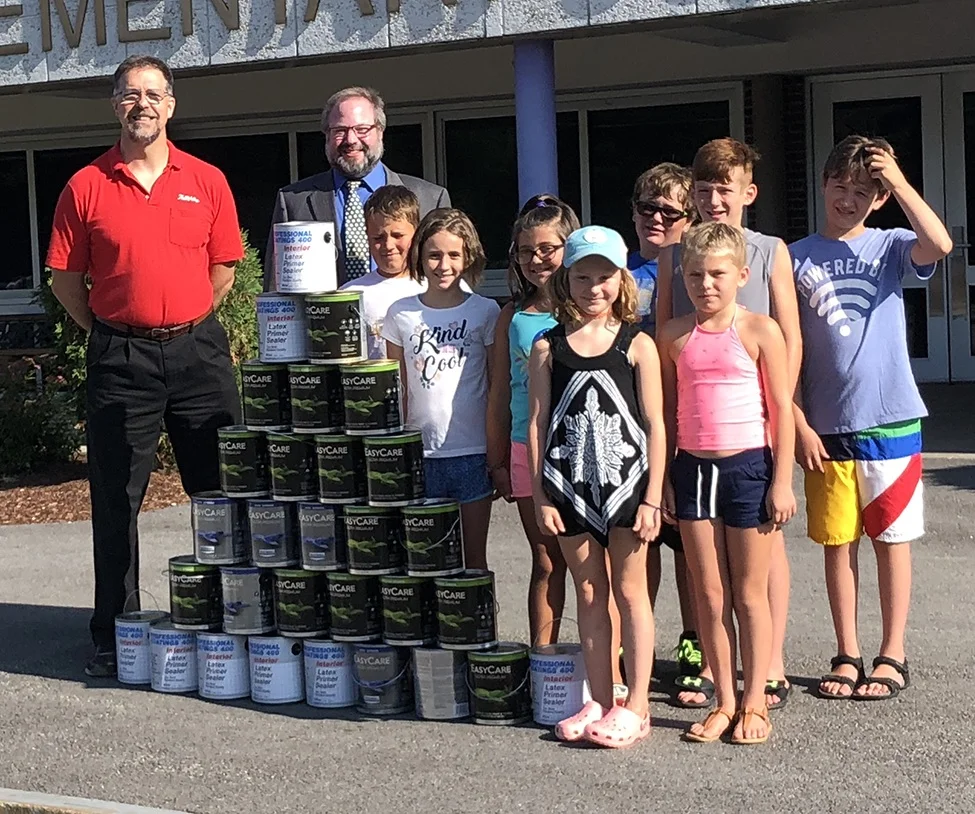 Paint to brighten schoolMaurice Fortune of Fortune's Hardware and School Superintendent Seth McGowan were joined by Tupper Lake day campers last week to show off the 30 gallons of paint that will soon be applied to the interior of the L.P. Quinn Ele…