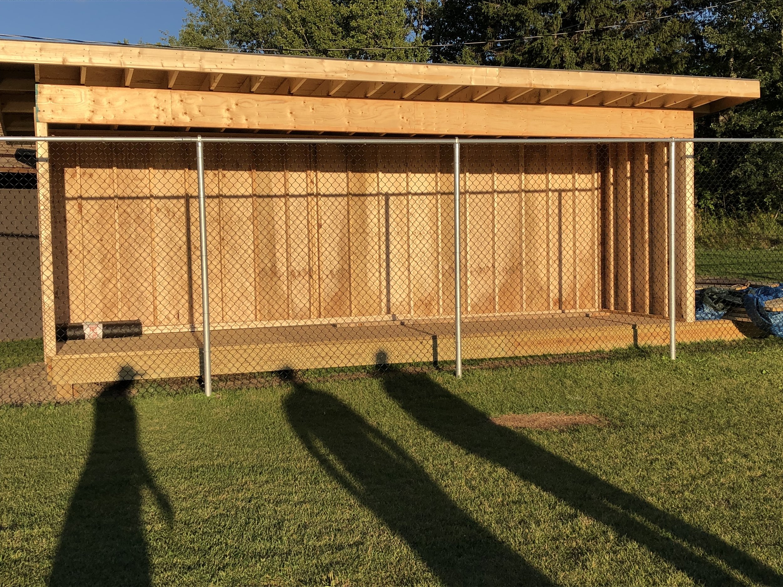   You are looking a brand new above-ground dug-out that volunteers of the Tupper Lake Youth Baseball and Softball Association erected in one day Saturday behind the backstop fence at the new Little League diamond in the Tupper Lake Municipal Park.  