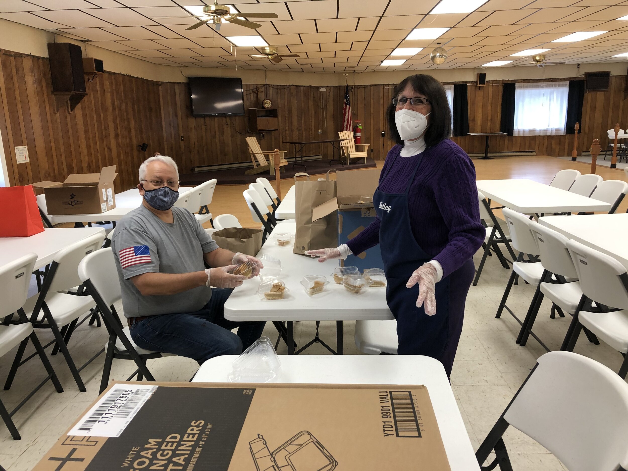    Knight Mark Moeller and volunteer Shelly Boushie were preparing pie portions before the deliveries began, among the many things they tackled that day.  