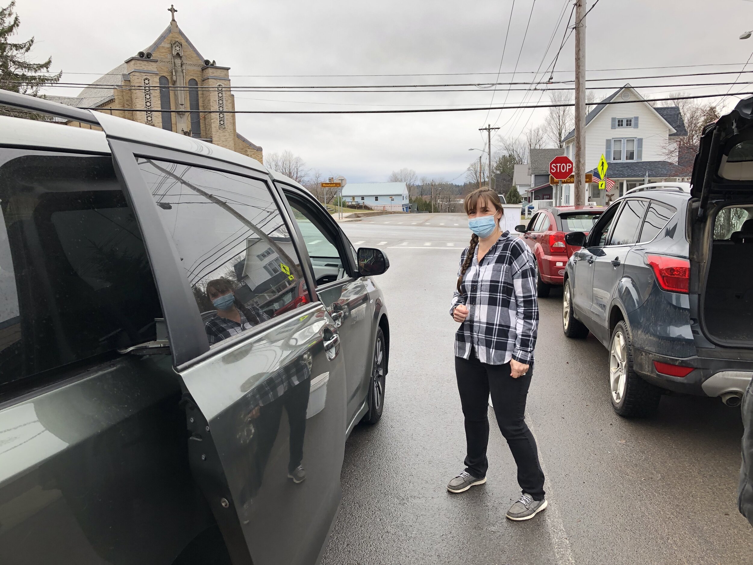    Jocelyn Savage, a local nurse, was one of the volunteers Thursday taking orders and delivering Thanksgiving meals to awaiting vehicles.  