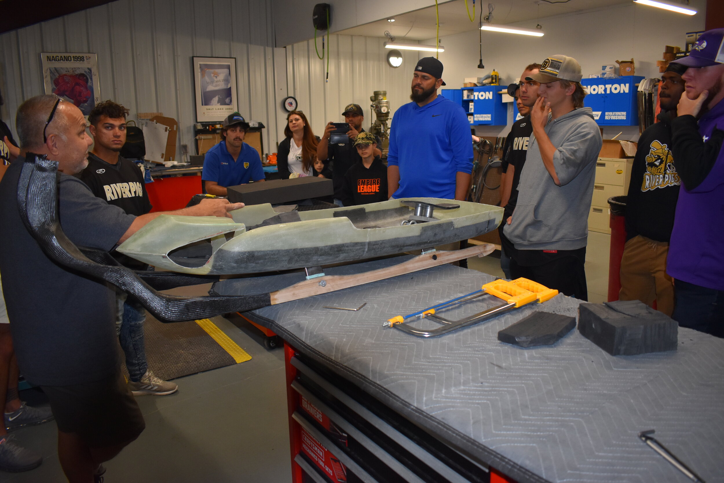    The Riverpigs get a lesson about the process of building an actual Olympic luge sled.  