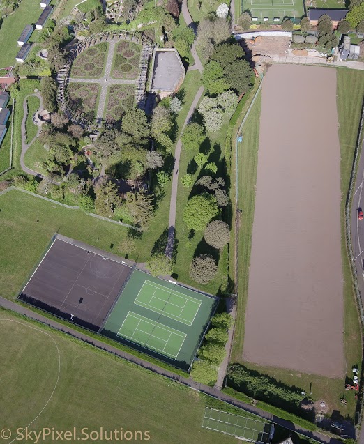 Preparing the oversite before excavating the foundations. Ten grass courts also under construction