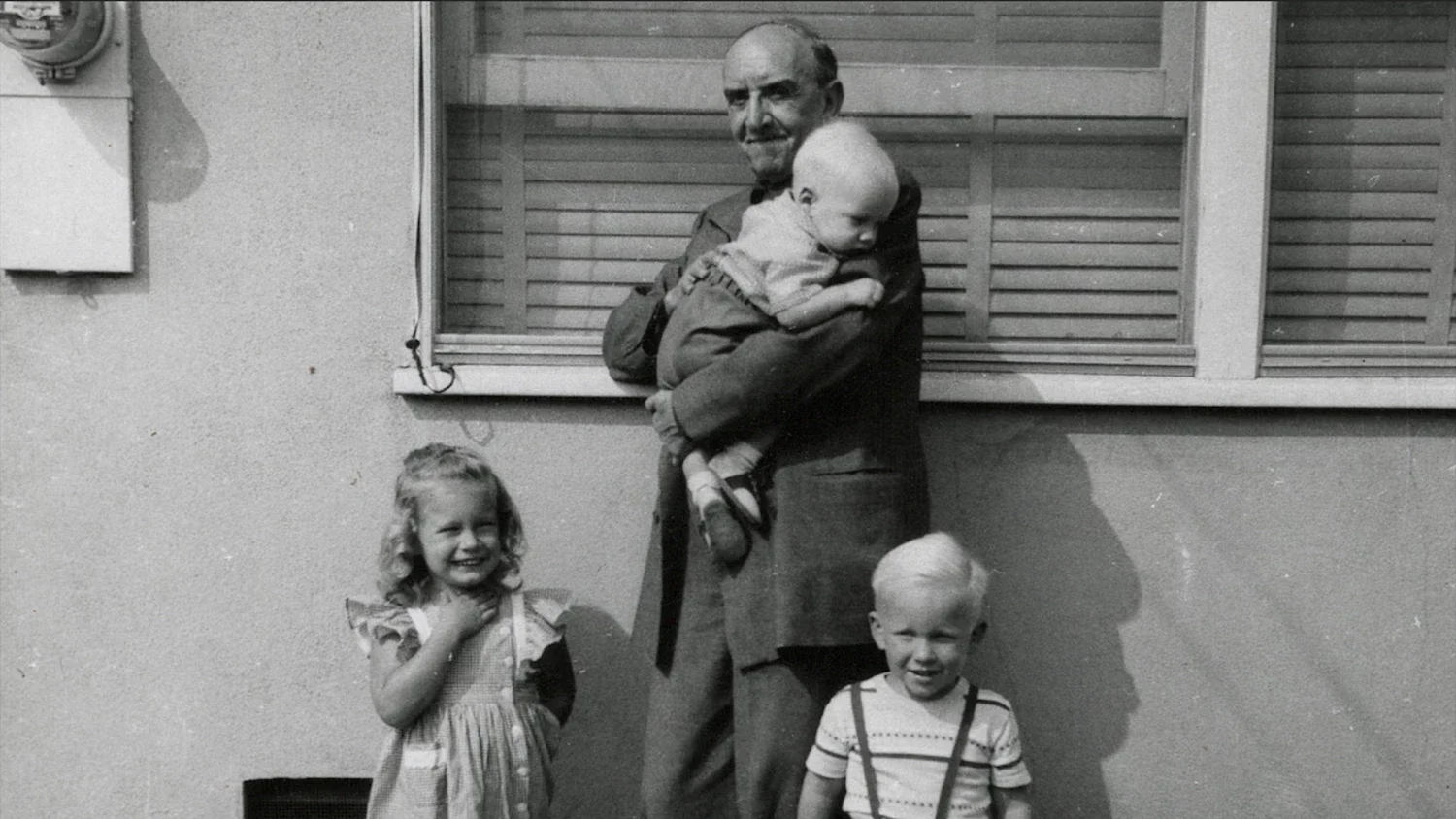 Mexican muralist, Roberto Montenegro, holding Kenton Nelson.