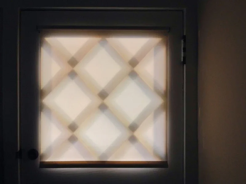 A door with a decorative frosted glass panel featuring a diamond pattern.