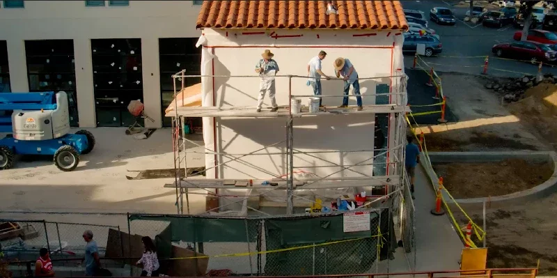 View of Kenton Nelson and his crew on scaffolding prepping the wall to install the Pasadena Playhouse Mosaic Mural,