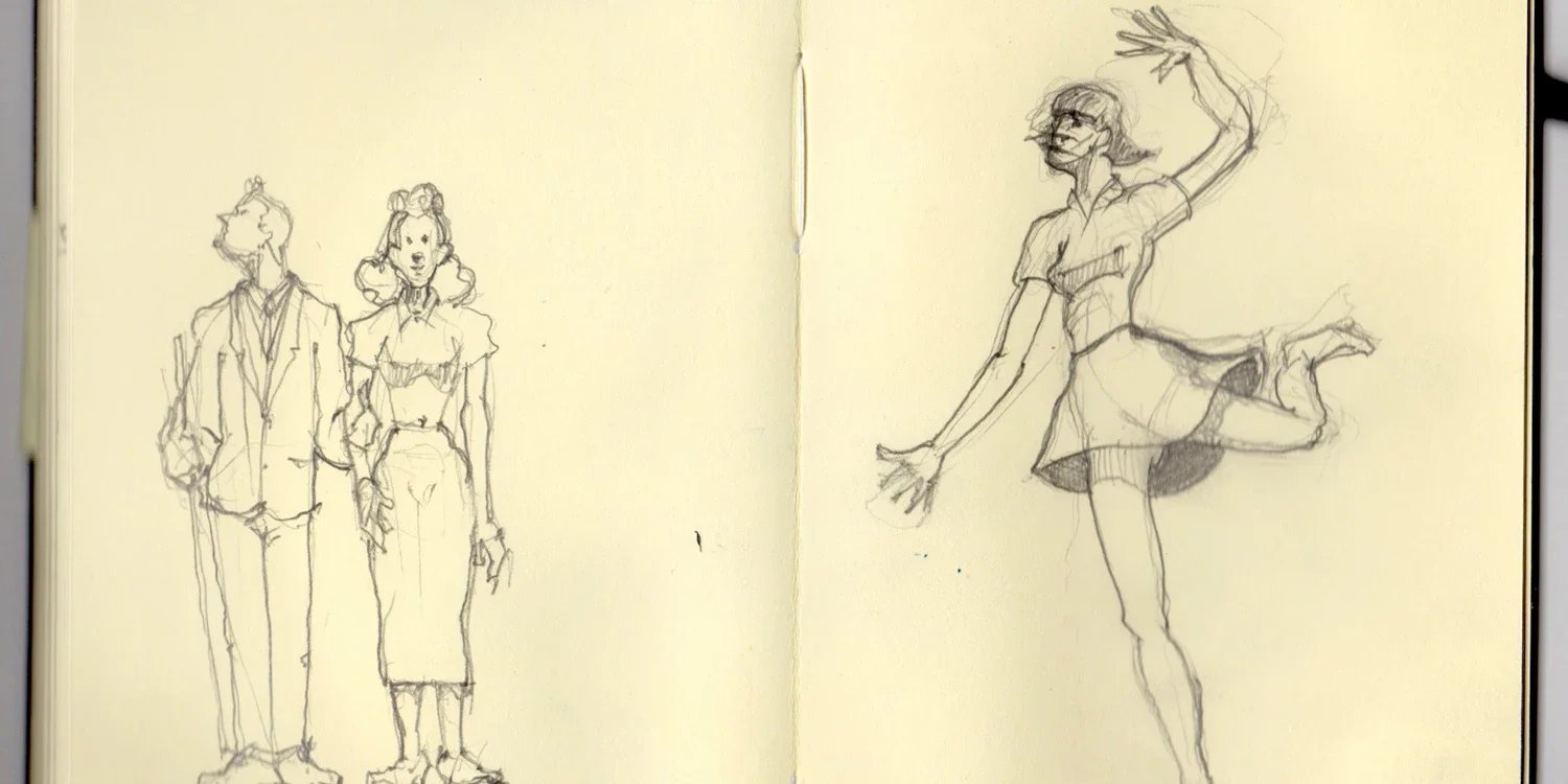 An open old notebook displaying characters that Kenton Nelson drew