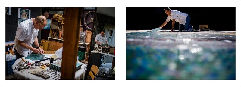 Two men working in a room and one man polishing a surface near water under a dark sky.
