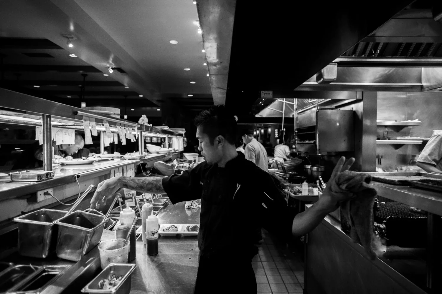 Chef Edgar Agbayani instructing his line cooks to manage the perfect timing of food orders in the kitchen