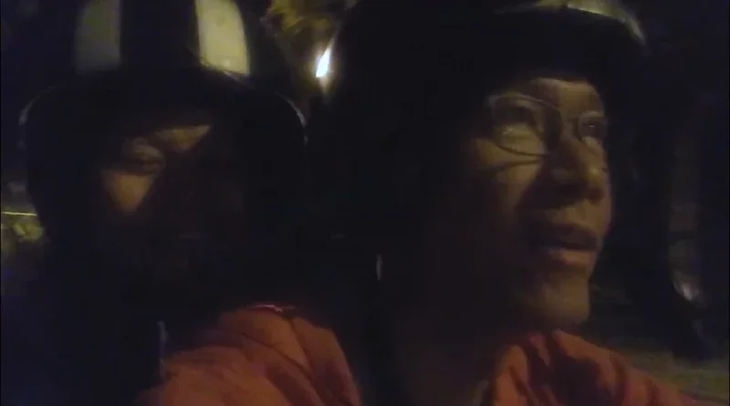 Man and his wife enjoying life while riding a Harley motorcycle