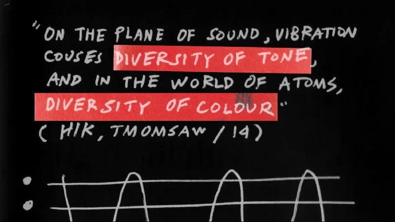 Handwritten quote in white chalk referencing sound and vibration, with two phrases highlighted in red: "DIVERSITY OF TONE" and "DIVERSITY OF COLOUR," on a black background, and a simple line graph below.