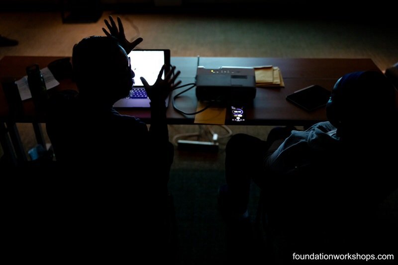 Photography coaching between two people behind the computer