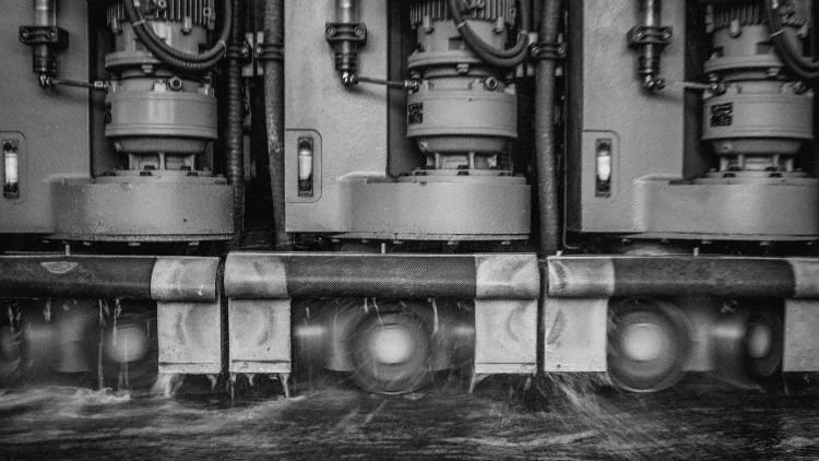 industrial size polishing machine running through the surface of a marble