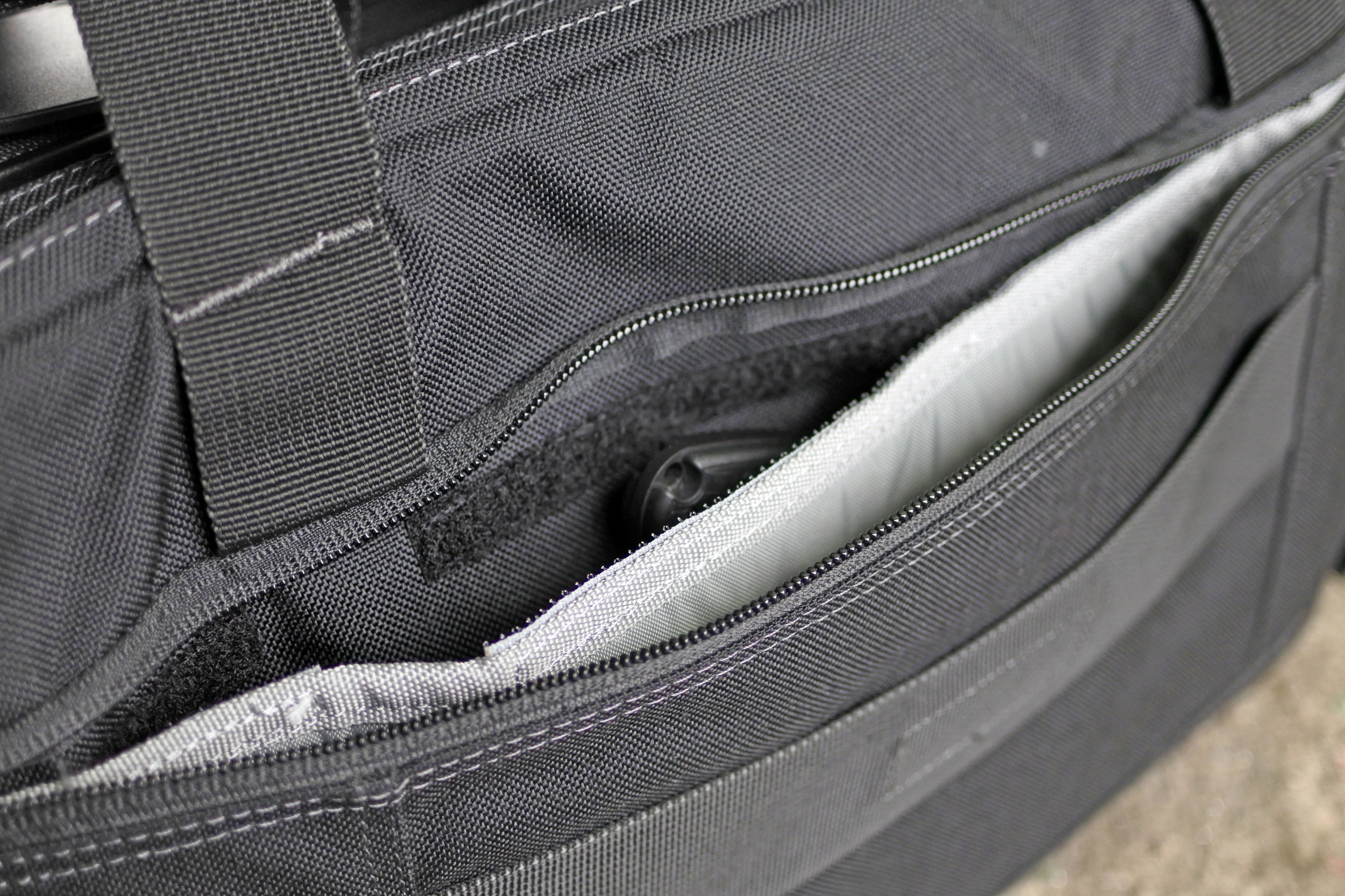 Looking into the CCW pocket on the rear here. That's an HK Plan D strapped in. This has the divider in it like the other CCW pockets from First Tactical. 
