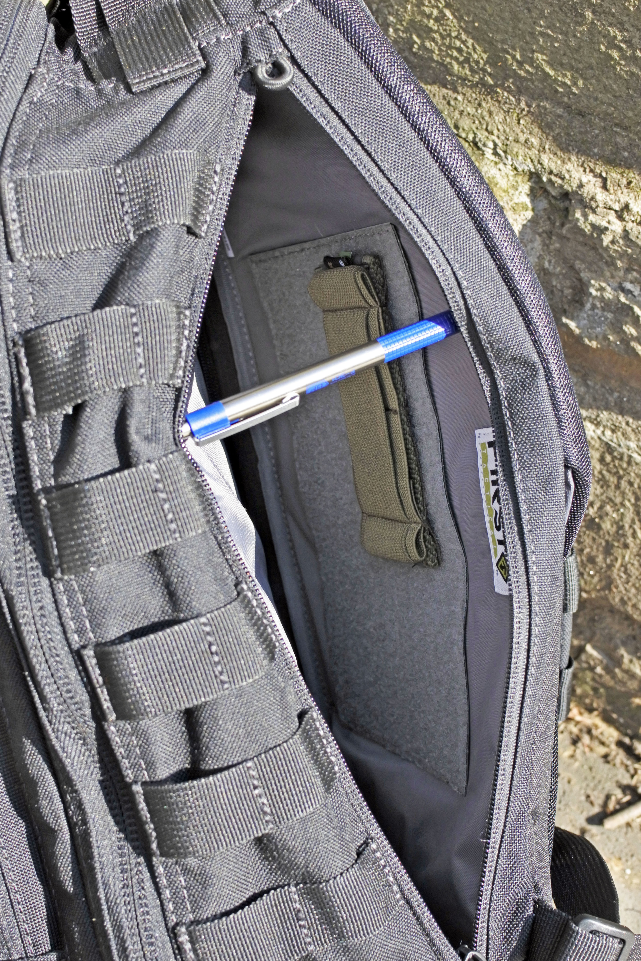 The elastic loop shown on the back wall is not included. 