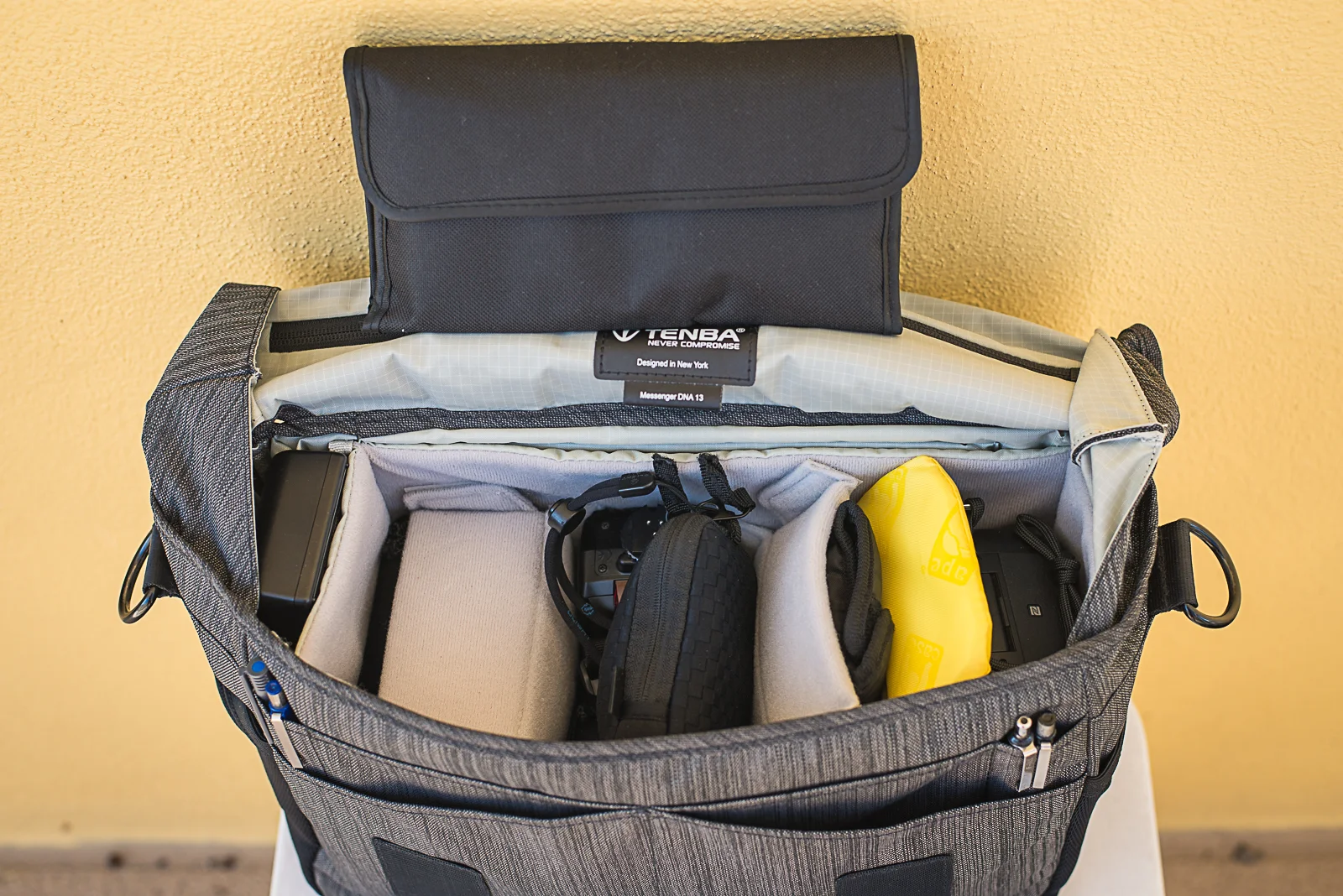 I recently moved and used the DNA 13 to hold most my camera gear except tripod. Items loaded here include: -3x lens hoods -neck strap -D7200 Body -3x Nikon batteries, 2x Sony Batteries -SB700 Clone -Nikon 18mm-35mm AF-D -Nikon 85mm f1.8 -Sigma Super Wide 24mm f2.8 -Sony RX100 M3 -Pelican SD card case -Nikon charger -Sony charger -4x filters in filet wallet