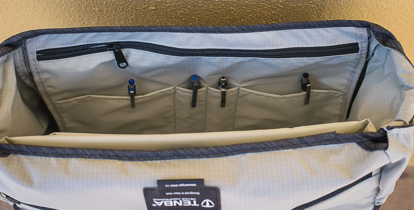 The zipper pocket in the front is a large slip pocket. 