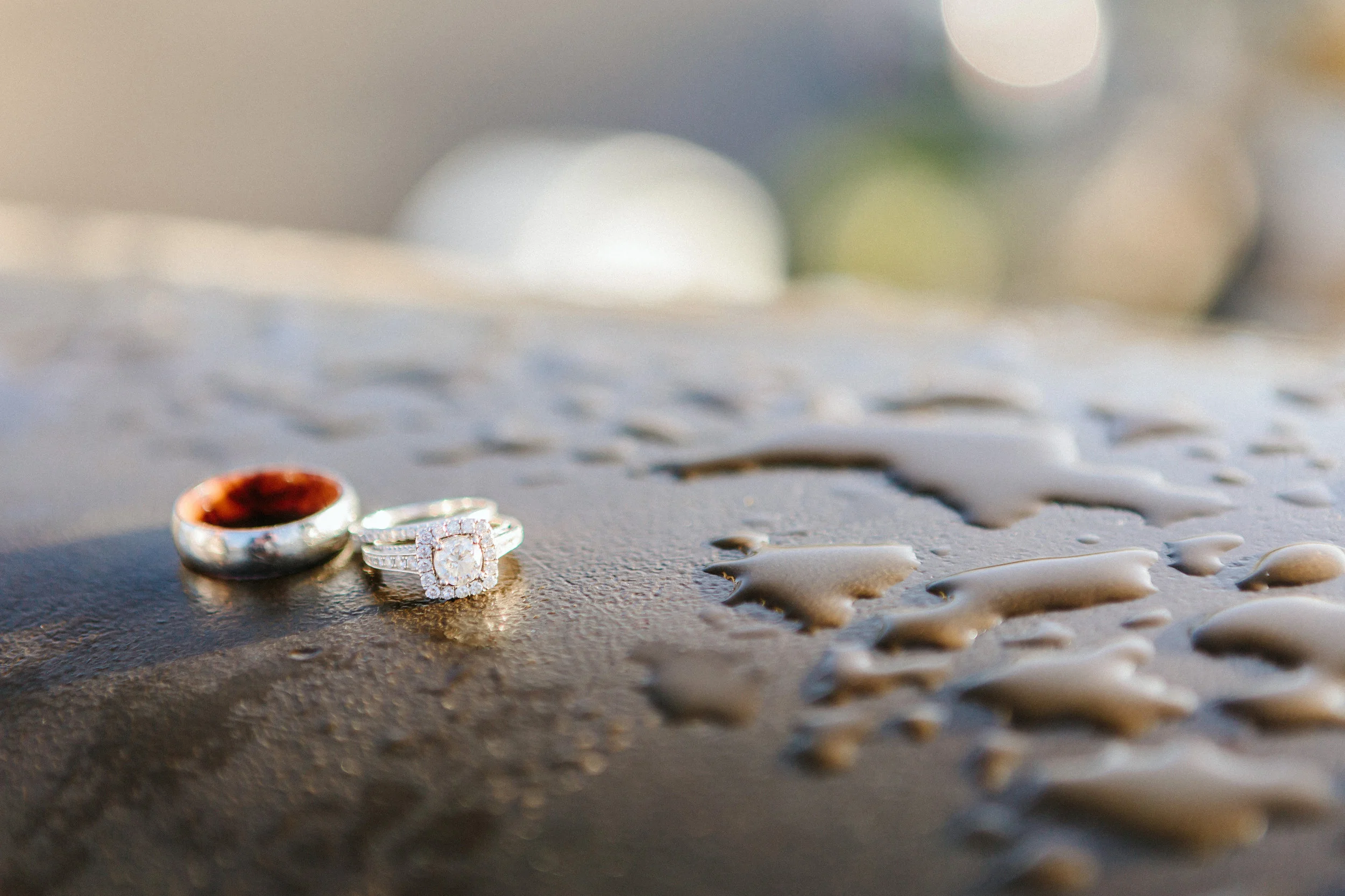 paris photographer engagement diamond ring detail in the rain on alexandre III bridge