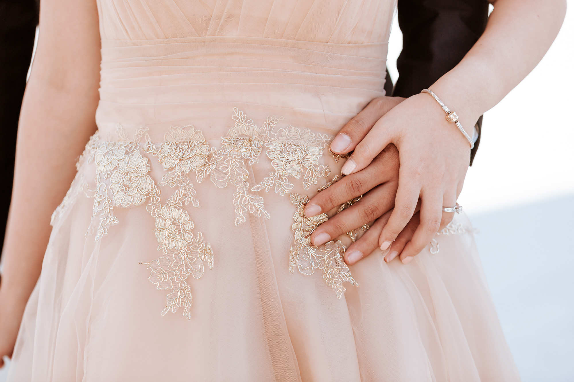 Pre-wedding couple photo session holding hands by the details of the dress captured by Paris Photographer Federico Guendel