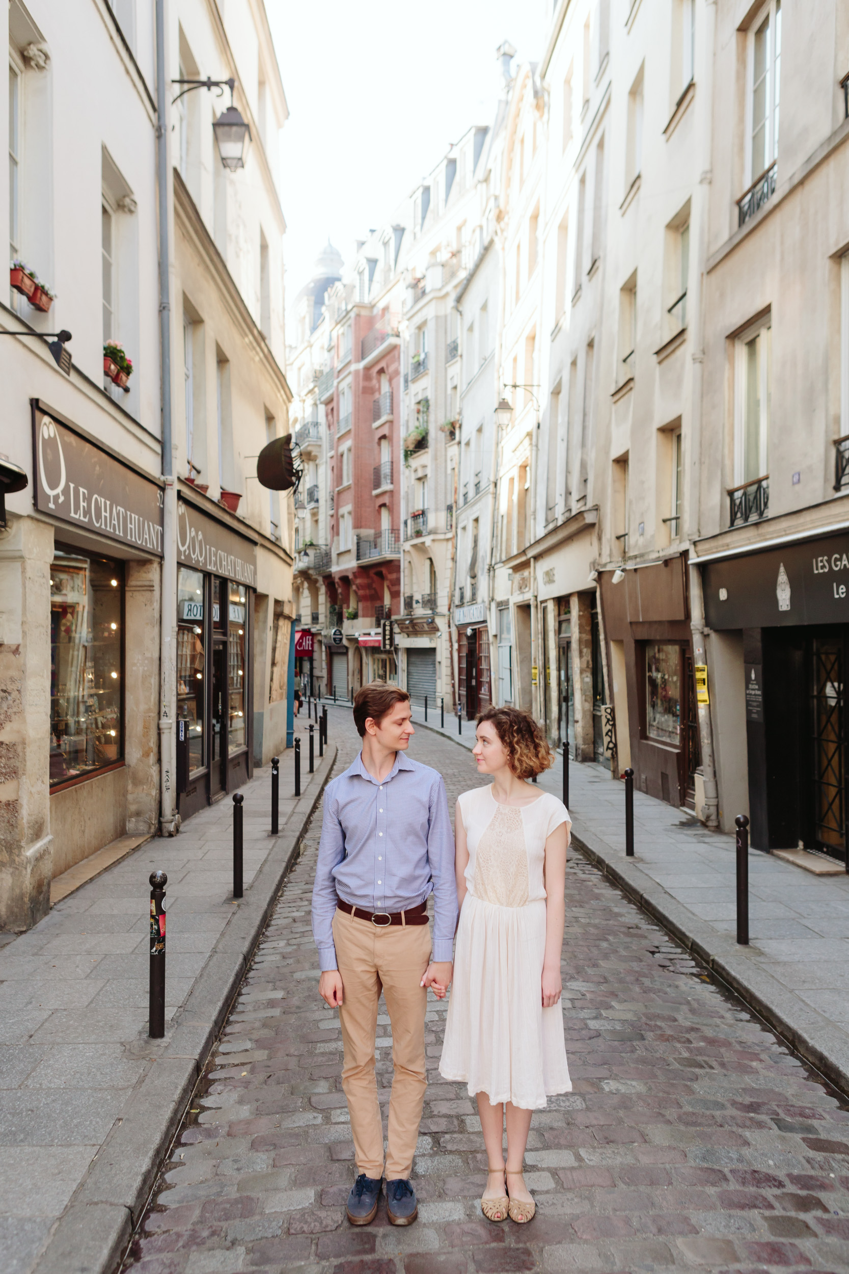 Couple in love standing the streets of Saint Germain in Paris captured by Paris Photographer Federico Guendel IheartParisFr