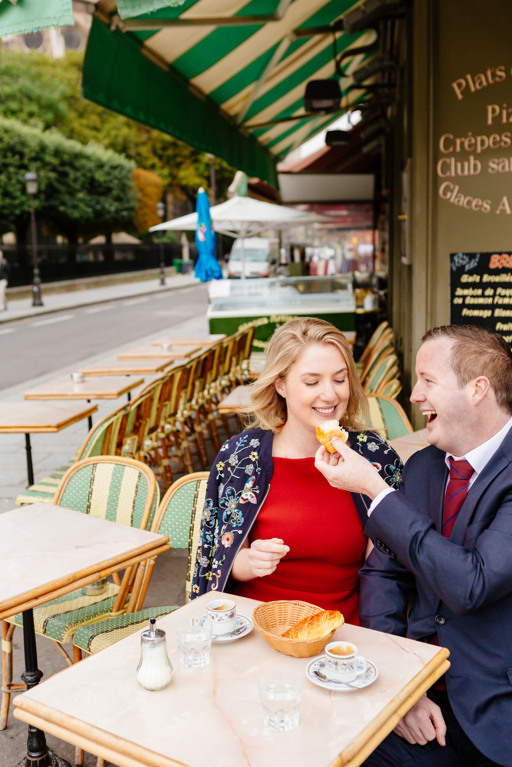 Couple sharing a croissant and coffee at cafe Esmeralda captured by Paris Photographer Federico Guendel www.iheartparis.fr
