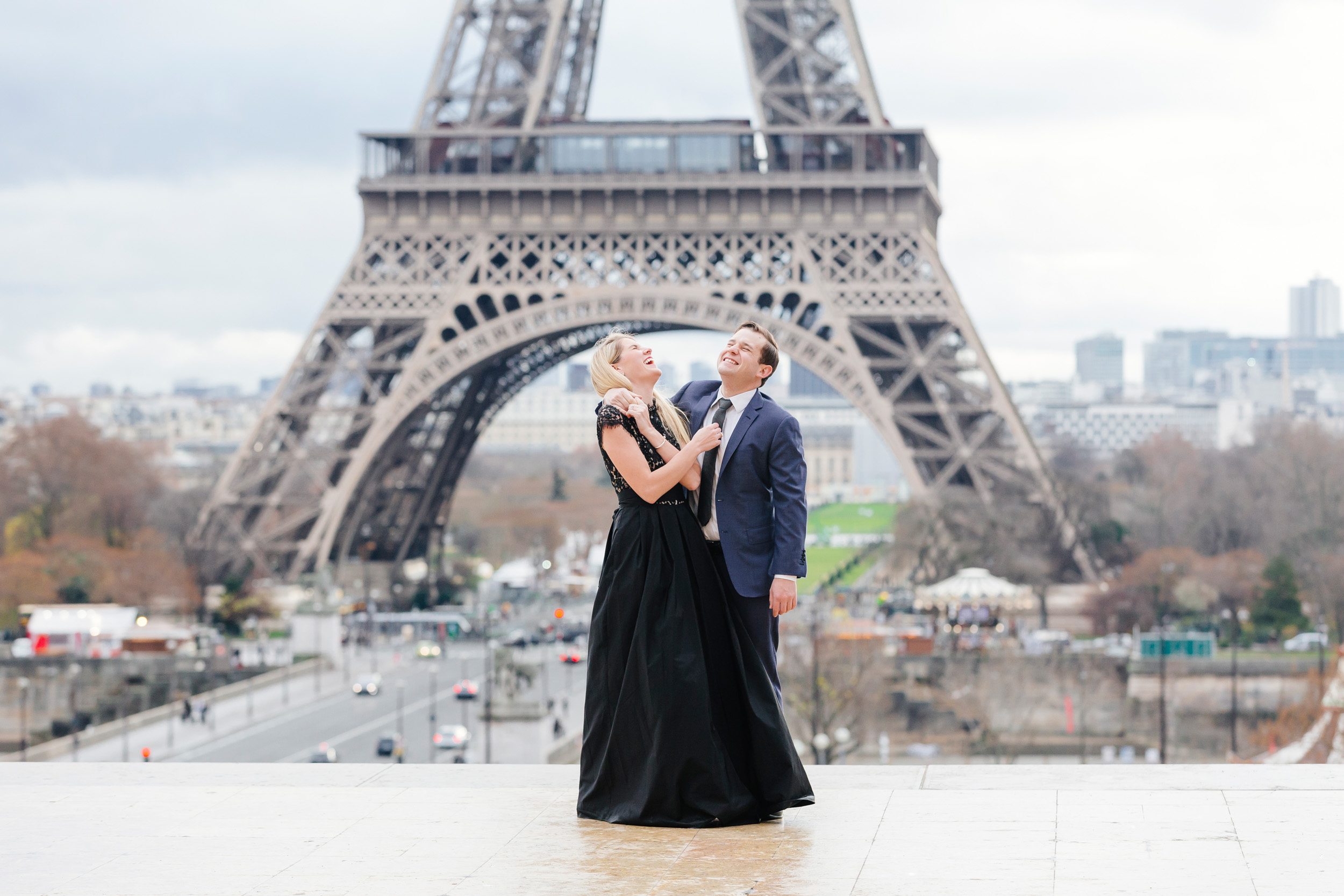 Paris vacation romantic couple portrait laughing happy at Trocadero with the view of Eiffel Tower captured by Paris Photographer Federico Guendel www.iheartparis.fr