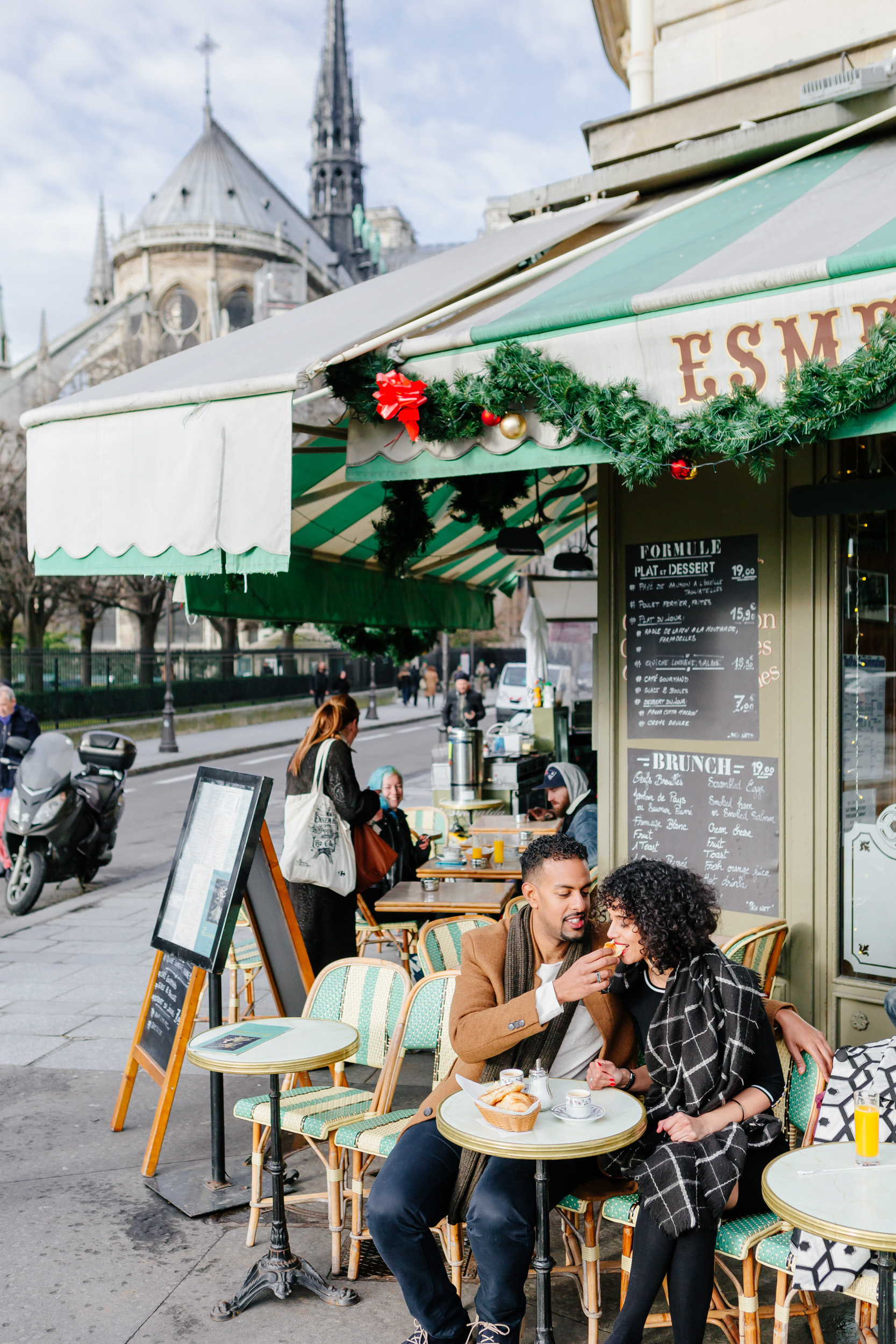 Couple session portrait by Notre Dame at cafe Esmeralda captured by Paris Photographer Federico Guendel IheartParis www.iheartparis.fr