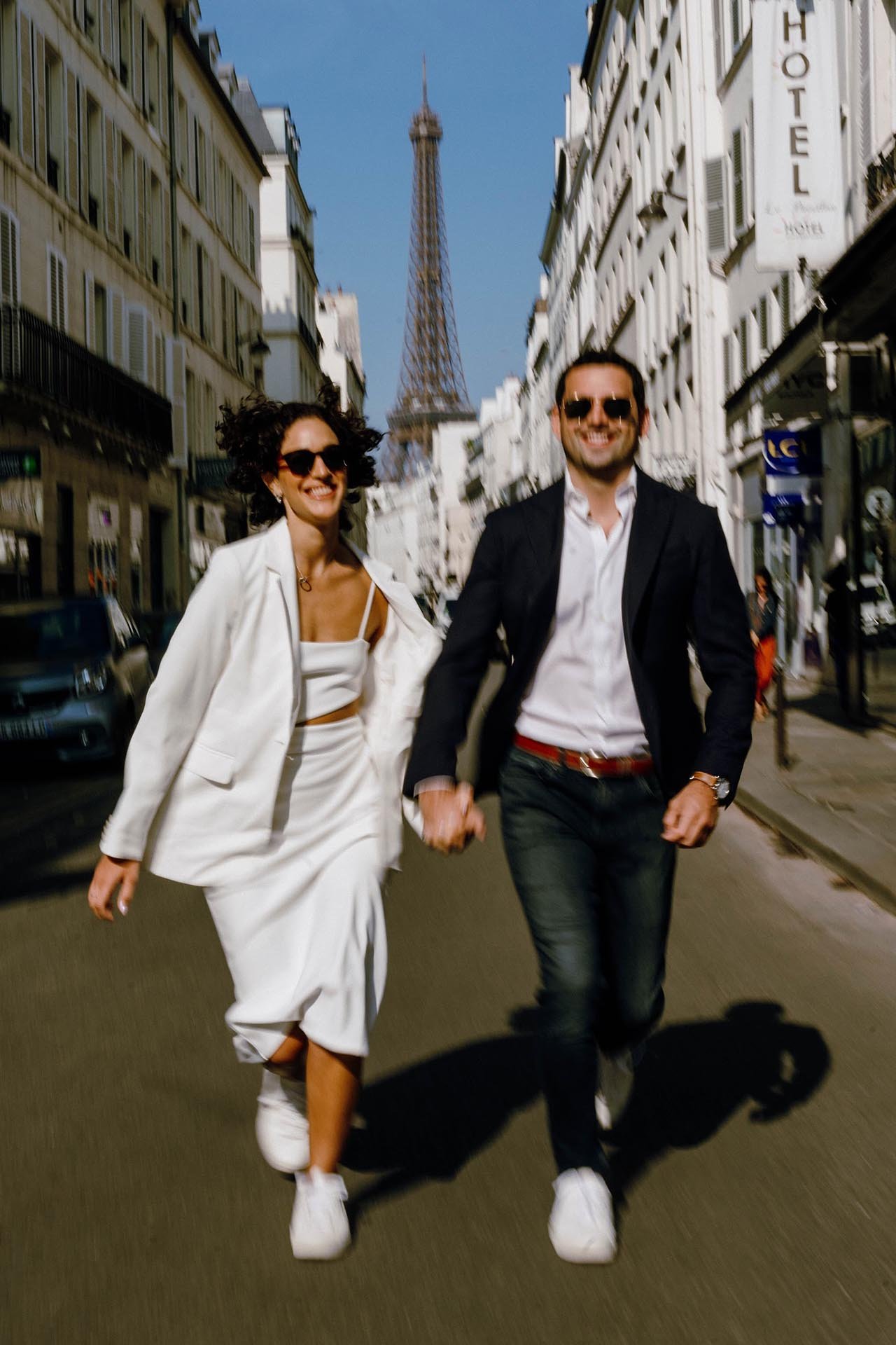 Fun Engagement Photos in Paris Rue de l Universite with Eiffel Tower