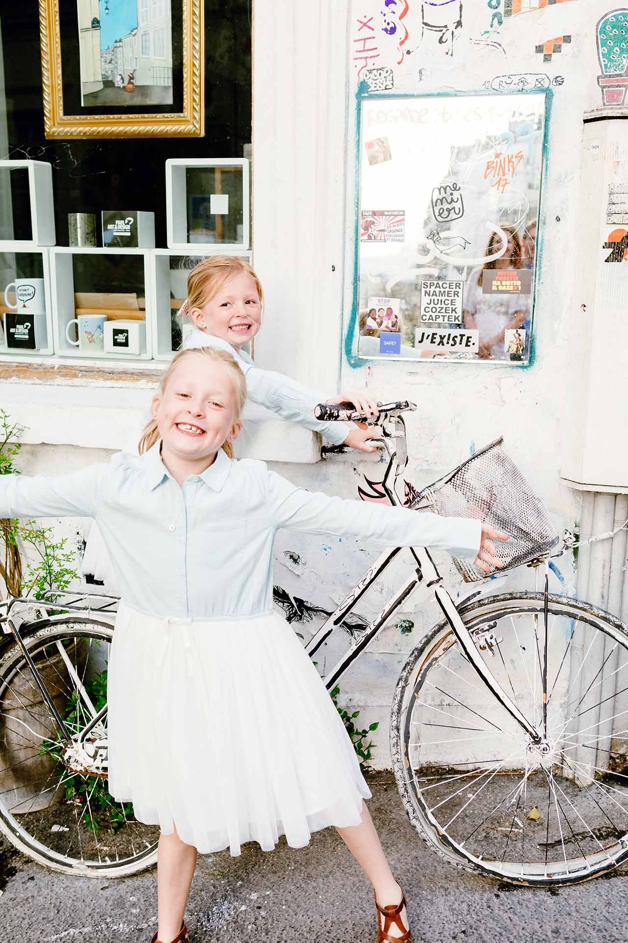 Fun on bicycle in montmartre family photoshoot