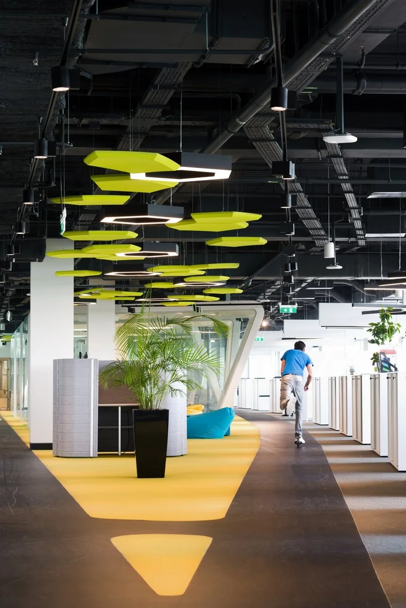 Scooter tracks on each floor in Adidas’ Moscow office reflect the company’s active lifestyle focus and encourage employees to move throughout the space. Photo from Office Snapshots .