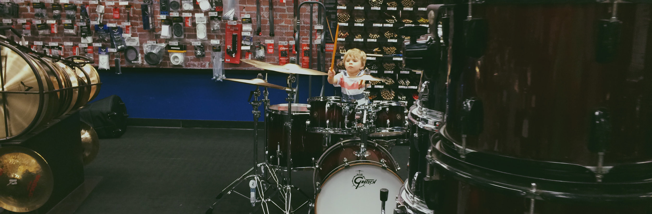 Sawyer at Guitar Center. His new favorite place to spend his time. Daddy is totally ok with that.