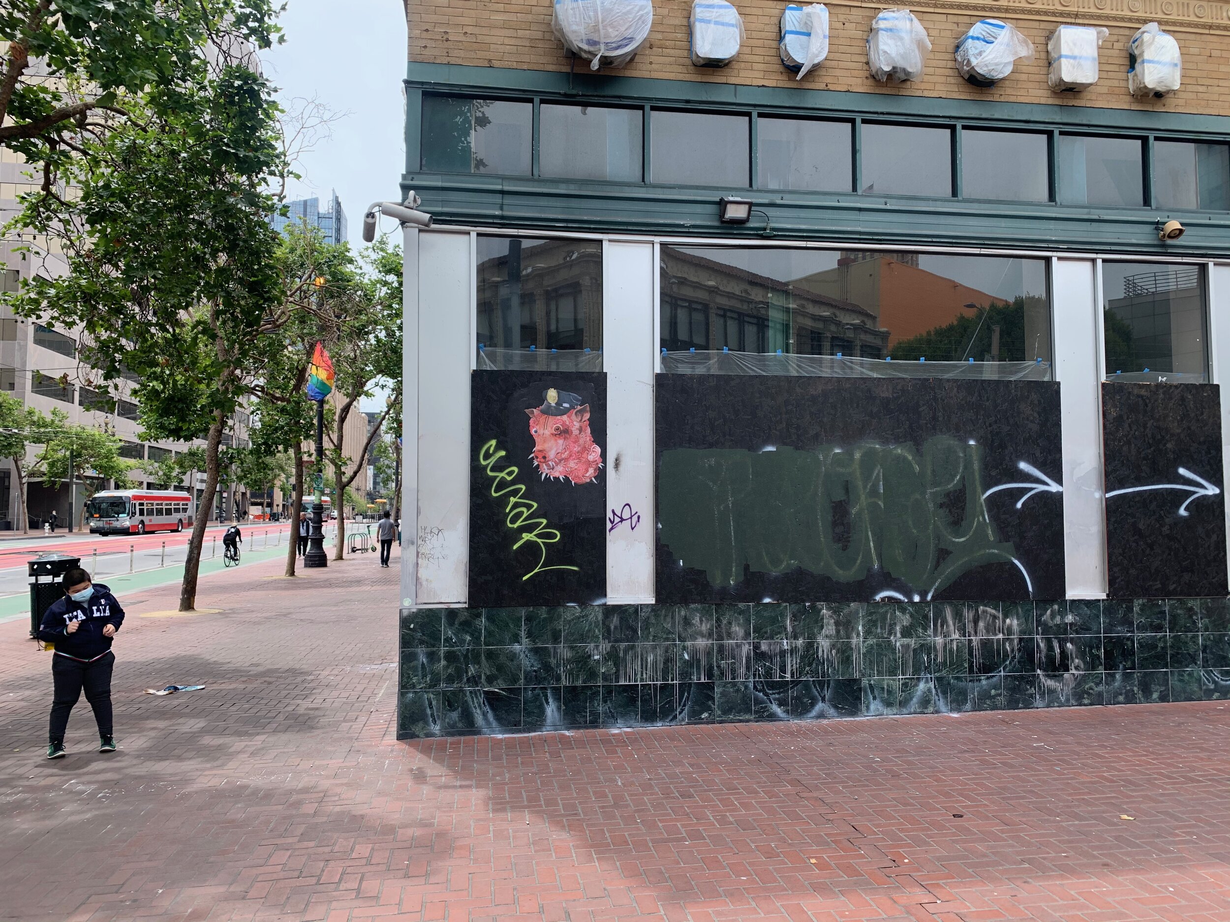  New artwork on long boarded up former Burger King.  June 31, 2020 