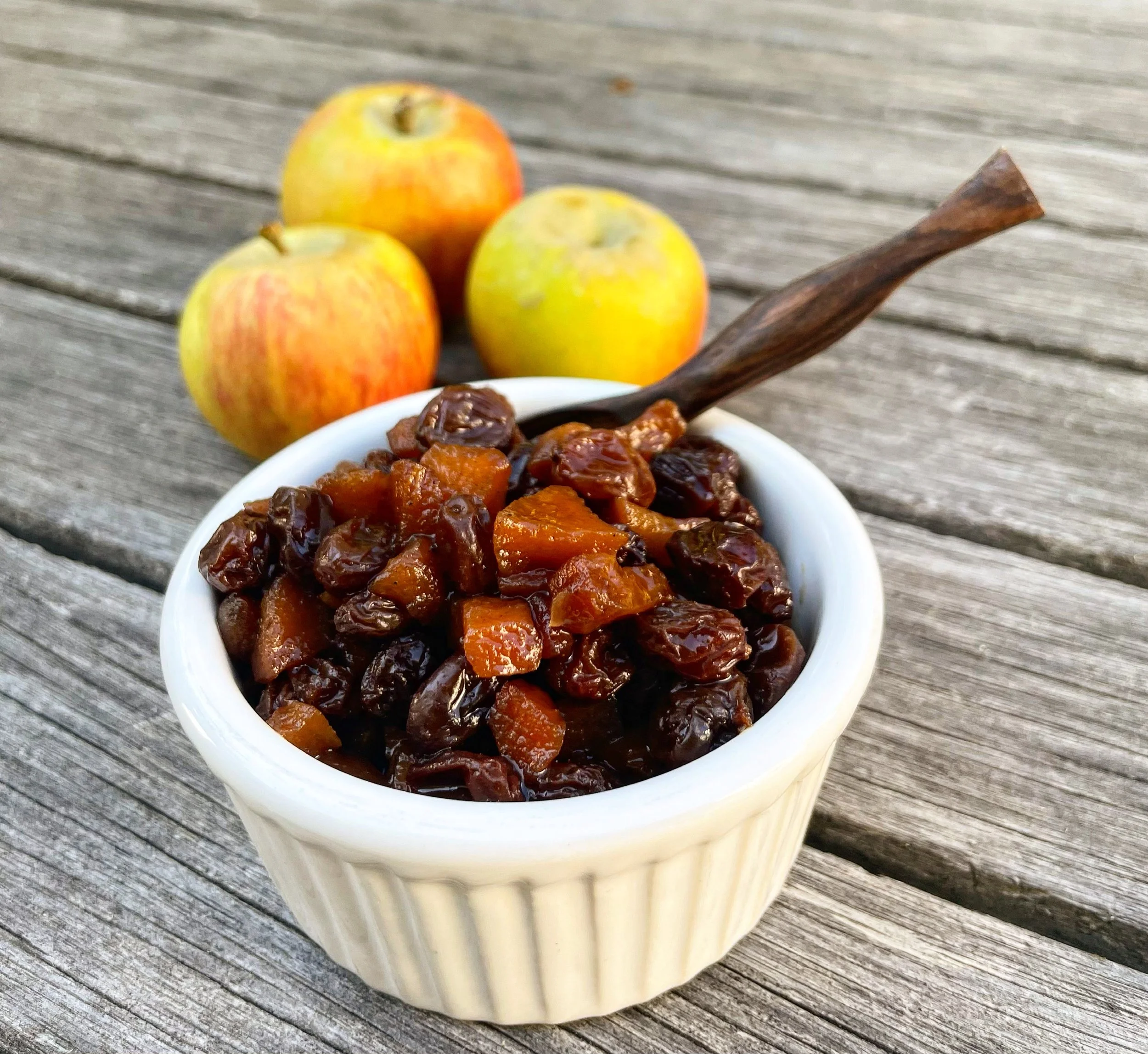 Apple, raisin, and date chutney served in a small bowl
