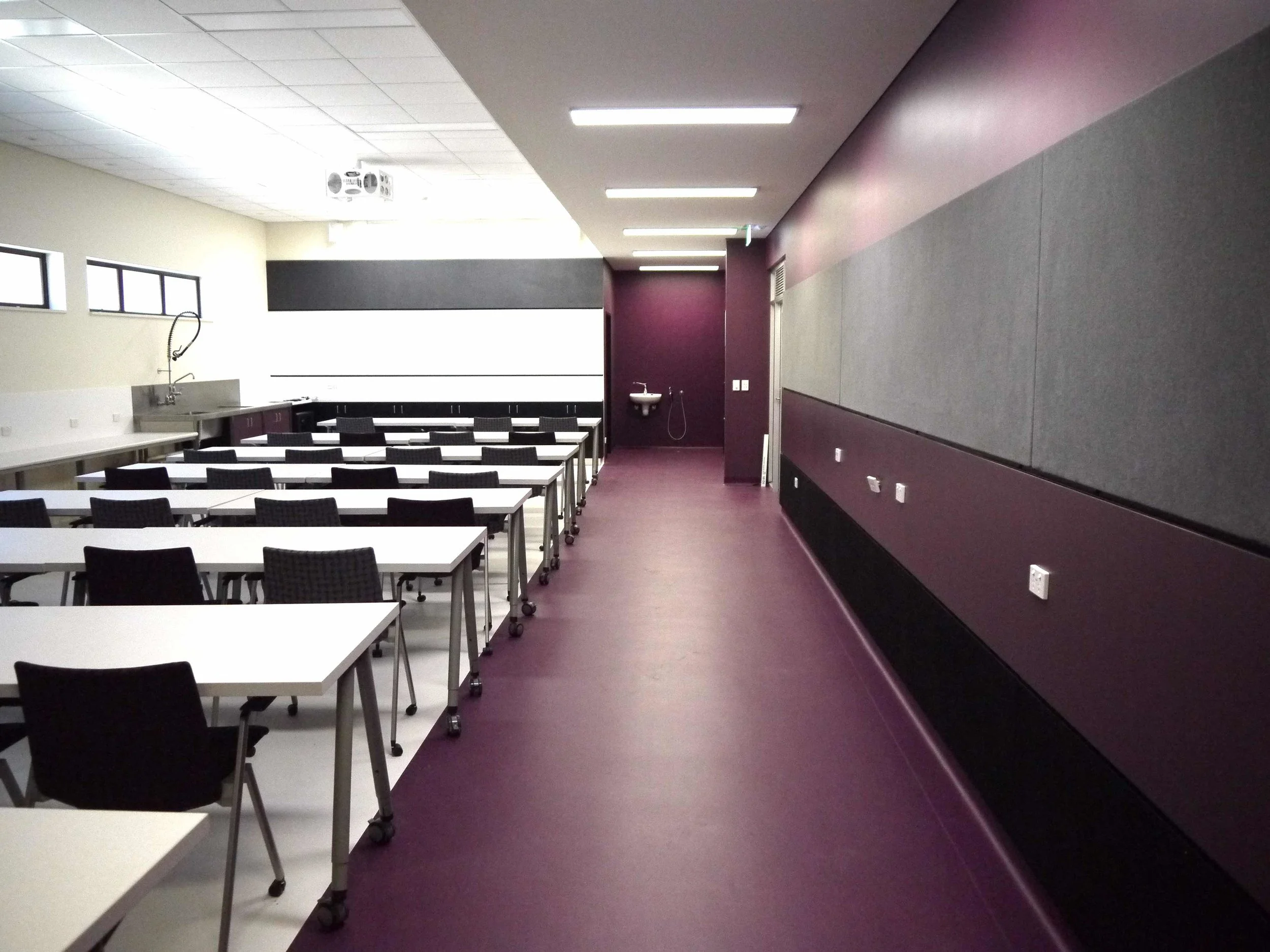 UniSA MLK | H2-01 Soil Science Laboratory Services: BESTEC Contractor: St Mary’s Building Services Photographer: W+S Refurbished student laboratory space at the University of South Australia Mawson Lakes Campus. The use of colour creates an ambience which sets a benchmark in how learning environments can help to inspire and stimulate. Utilising dynamic furniture the space can quickly transform a typical classroom layout into an arrangement more suited to group discussions or around the perimeter of the room for access to power, data and sinks for the messy soil science experiments.