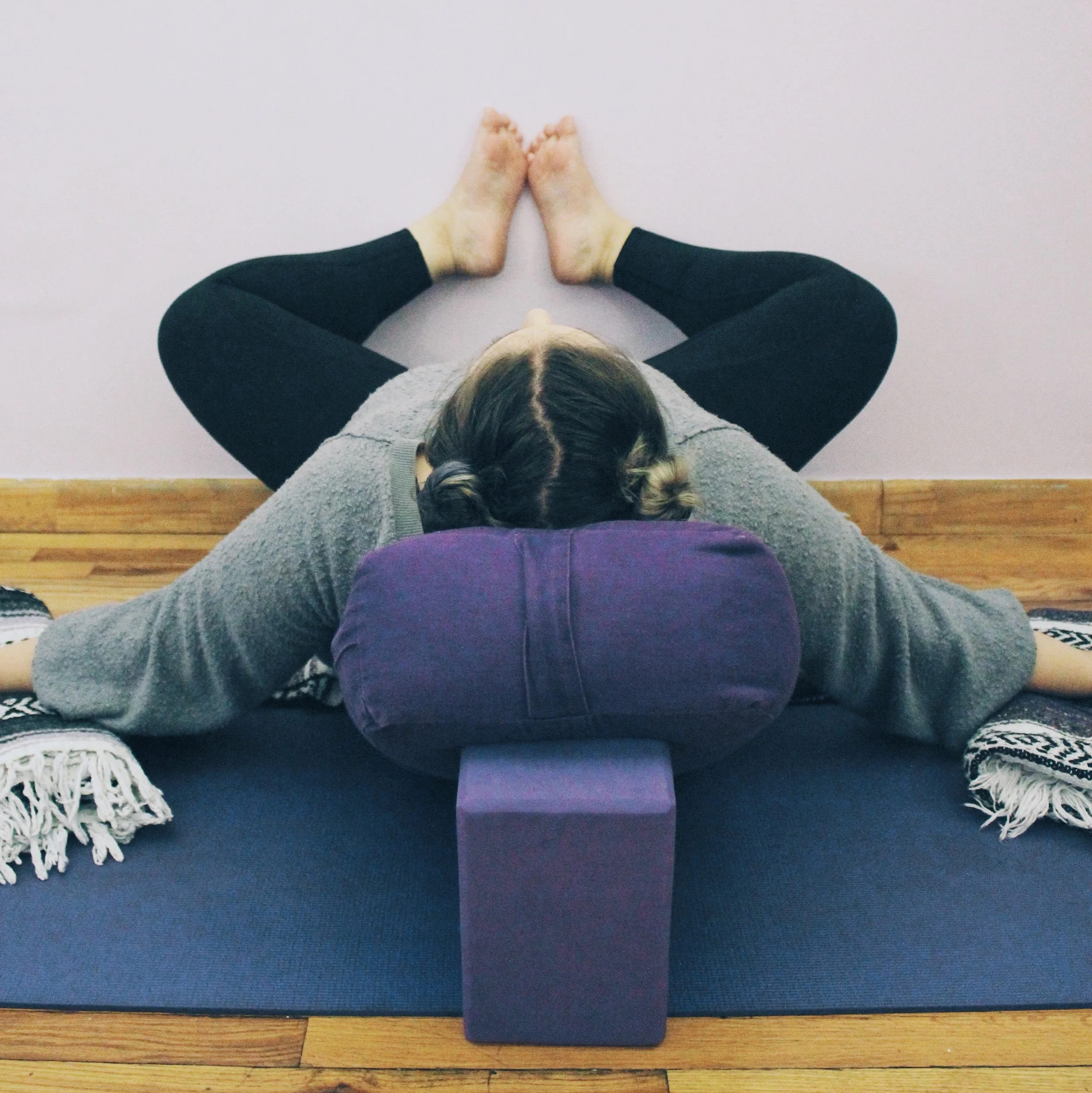 ashley doing restorative baddha konasana.jpg