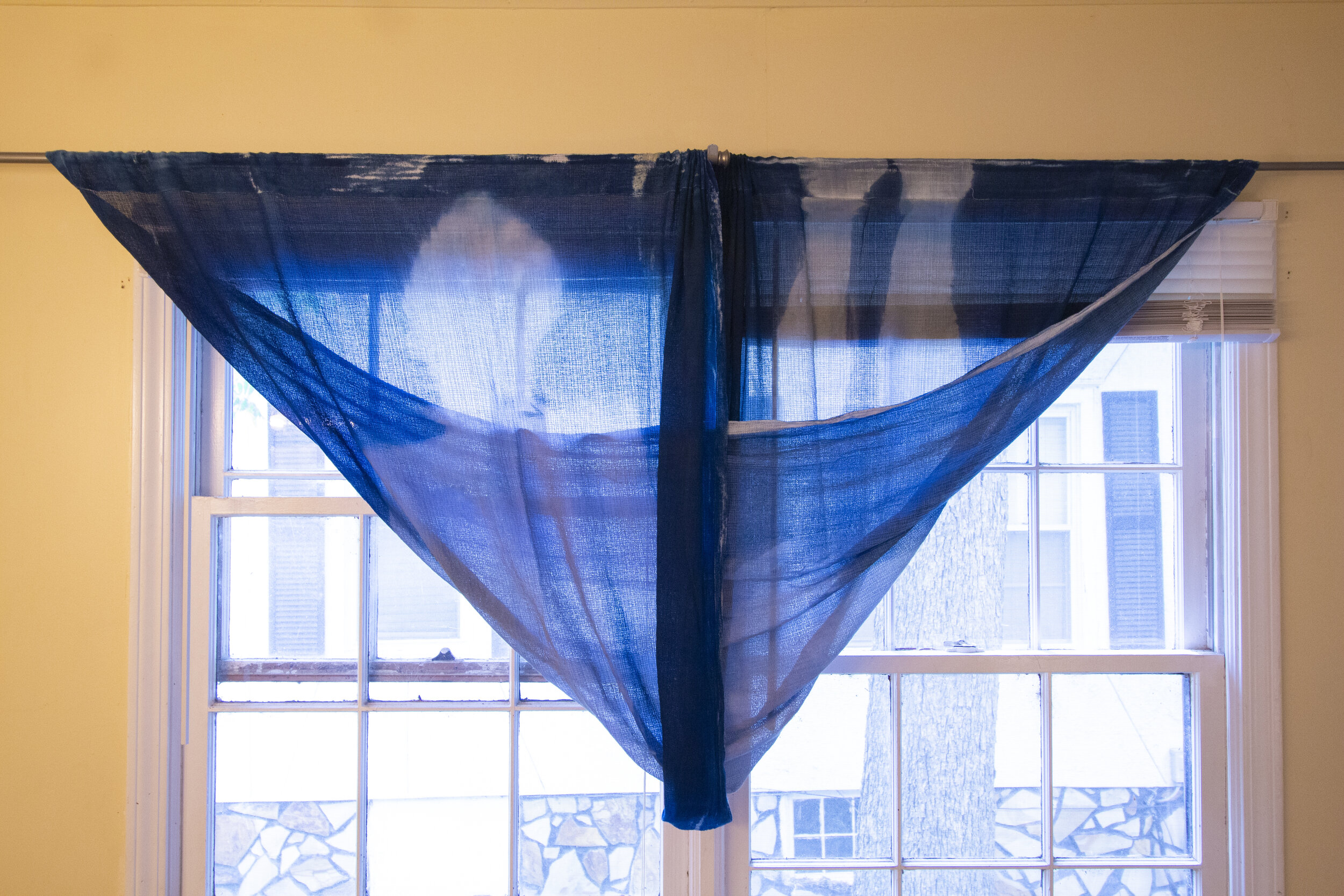 Full Twist [midday], 2020, cotton curtain, cyanotype solution, curtain rod, and hardware, 110 x 42 inches