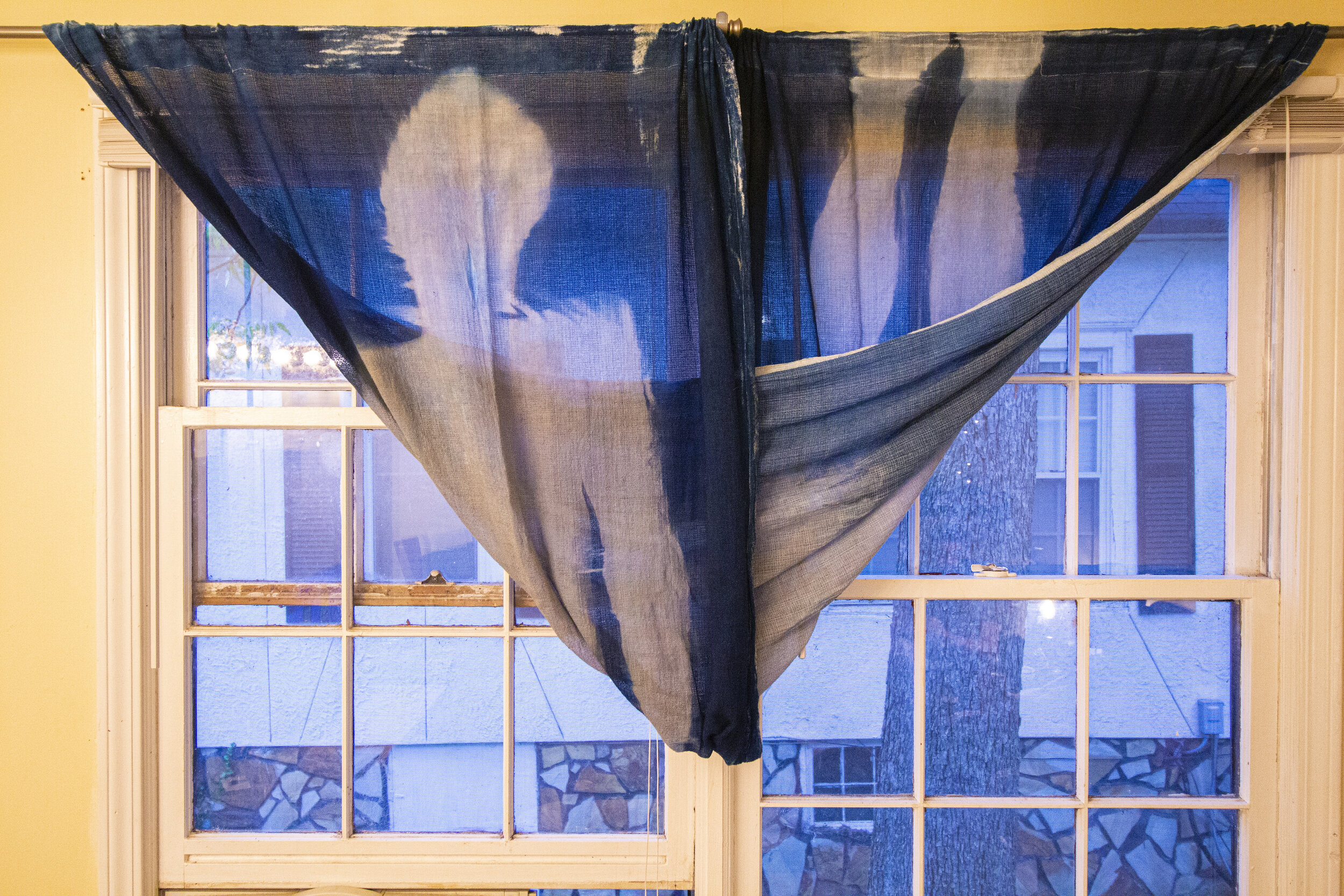 Full Twist [early evening], 2020, cotton curtain, cyanotype solution, curtain rod, and hardware, 110 x 42 inches