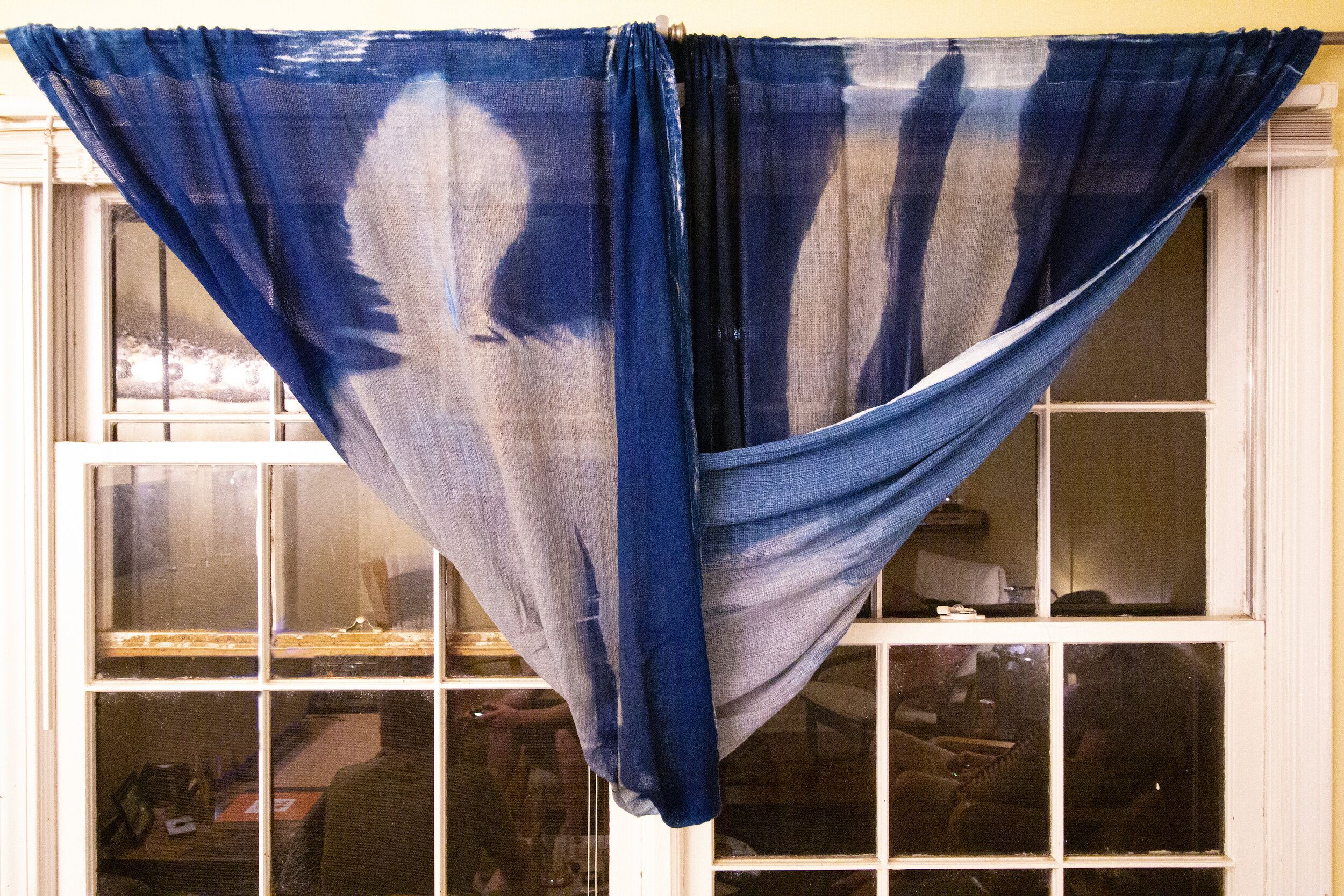 Full Twist [night], 2020, cotton curtain, cyanotype solution, curtain rod, and hardware, 110 x 42 inches