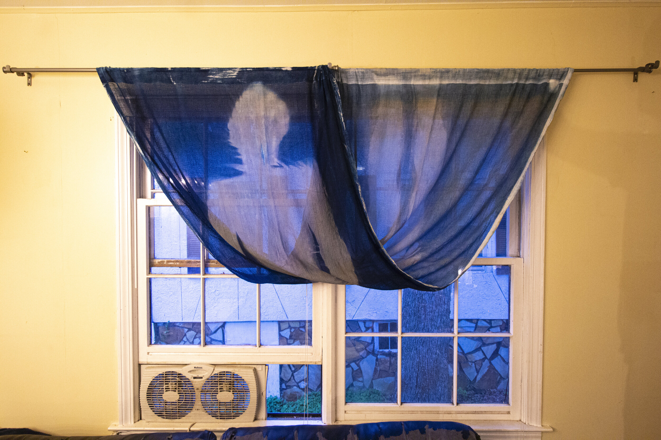 Half Twist [early evening], 2020, cotton curtain, cyanotype solution, curtain rod, and hardware, 110 x 42 inches
