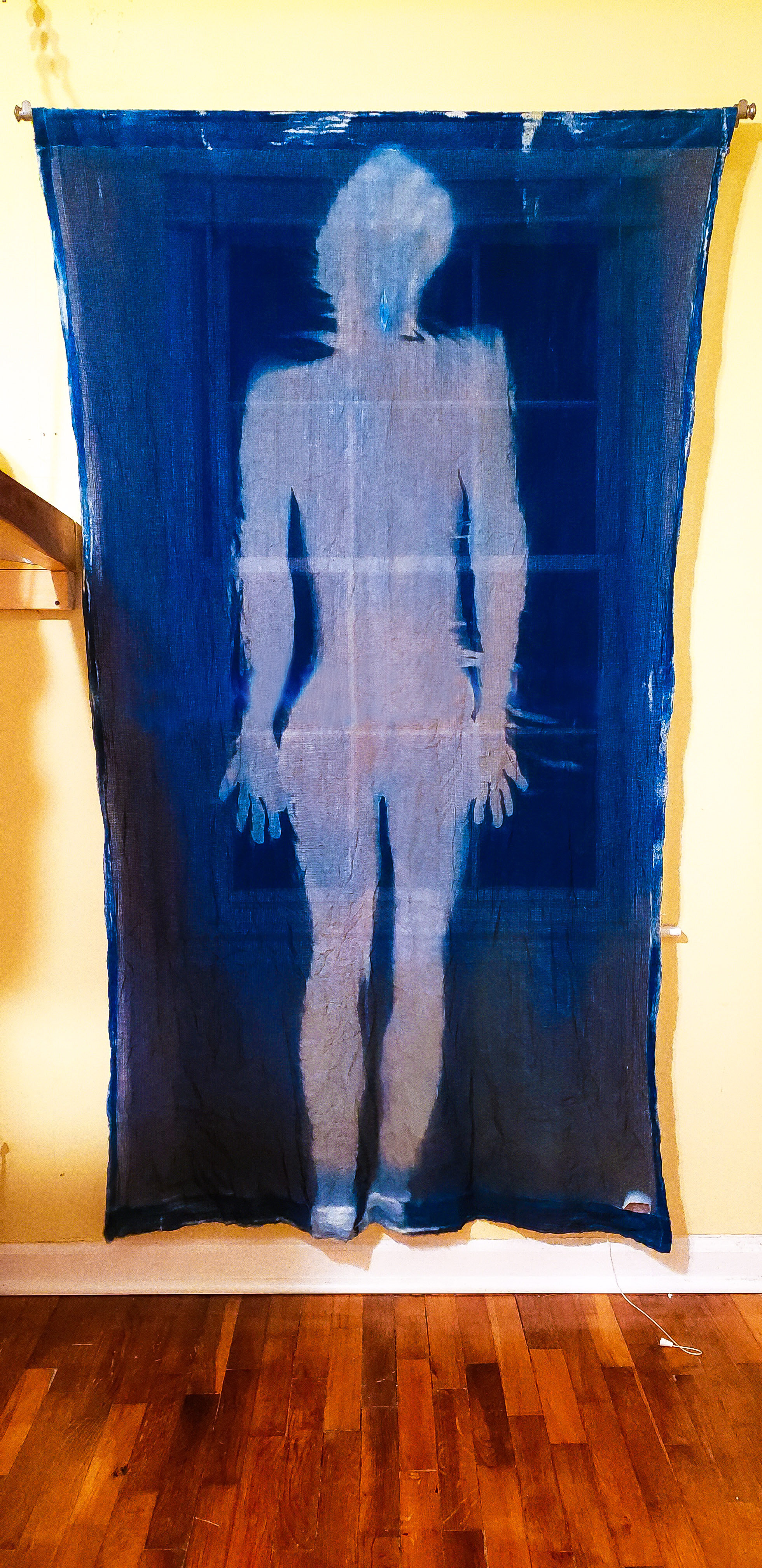 Stasis [night], 2020, cotton curtain, cyanotype solution, curtain rod, and hardware, 55 x 84 inches