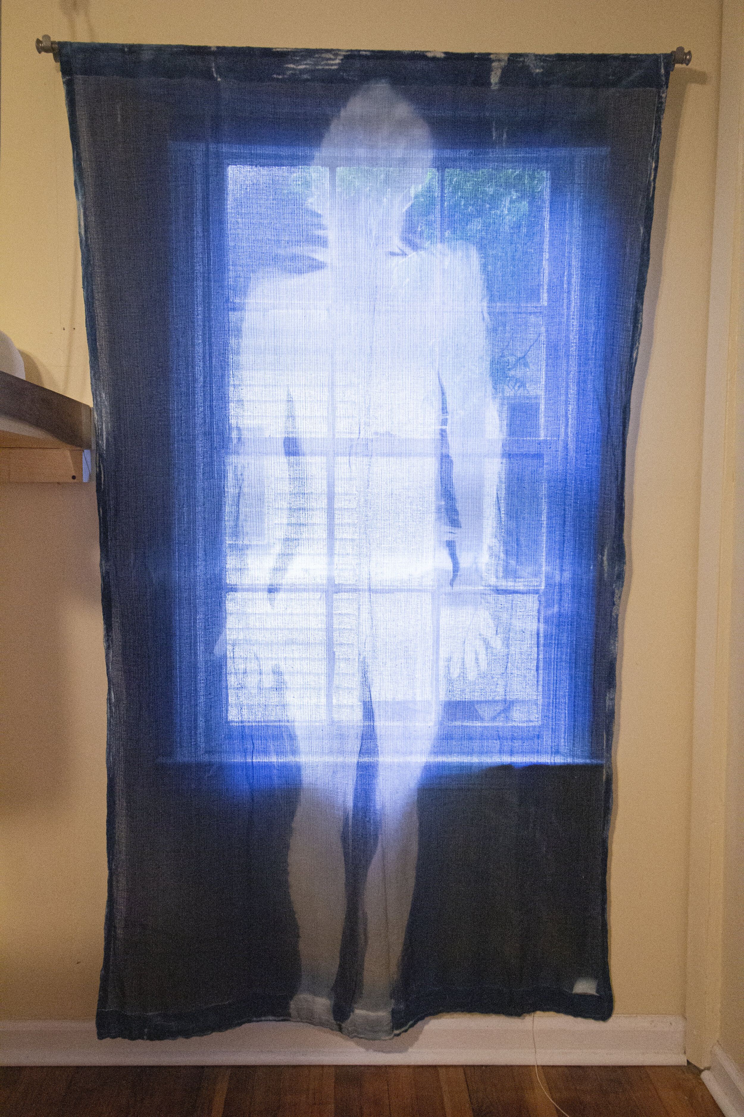 Stasis [early evening], 2020, cotton curtain, cyanotype solution, curtain rod, and hardware, 55 x 84 inches