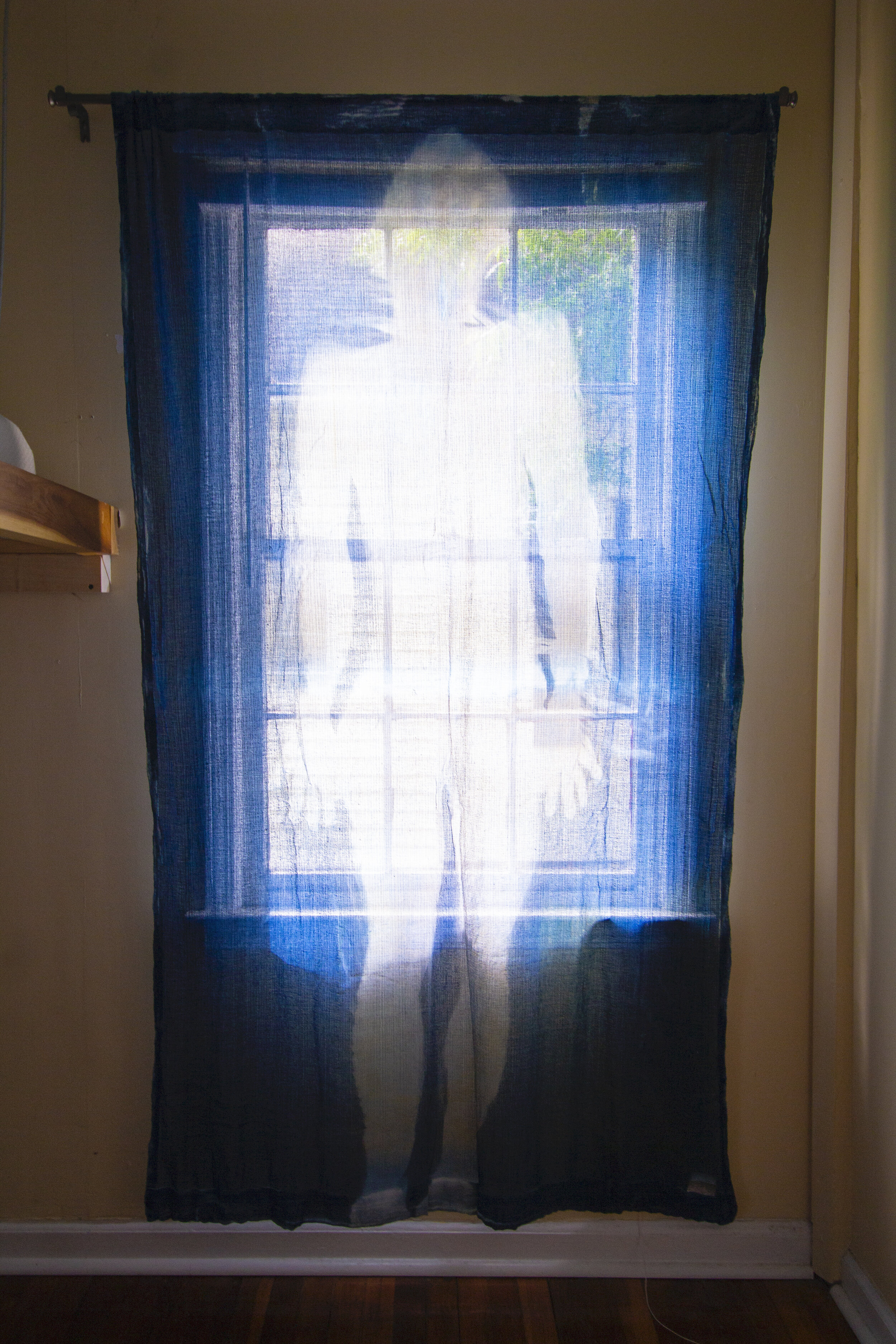 Stasis [midday], 2020, cotton curtain, cyanotype solution, curtain rod, and hardware, 55 x 84 inches