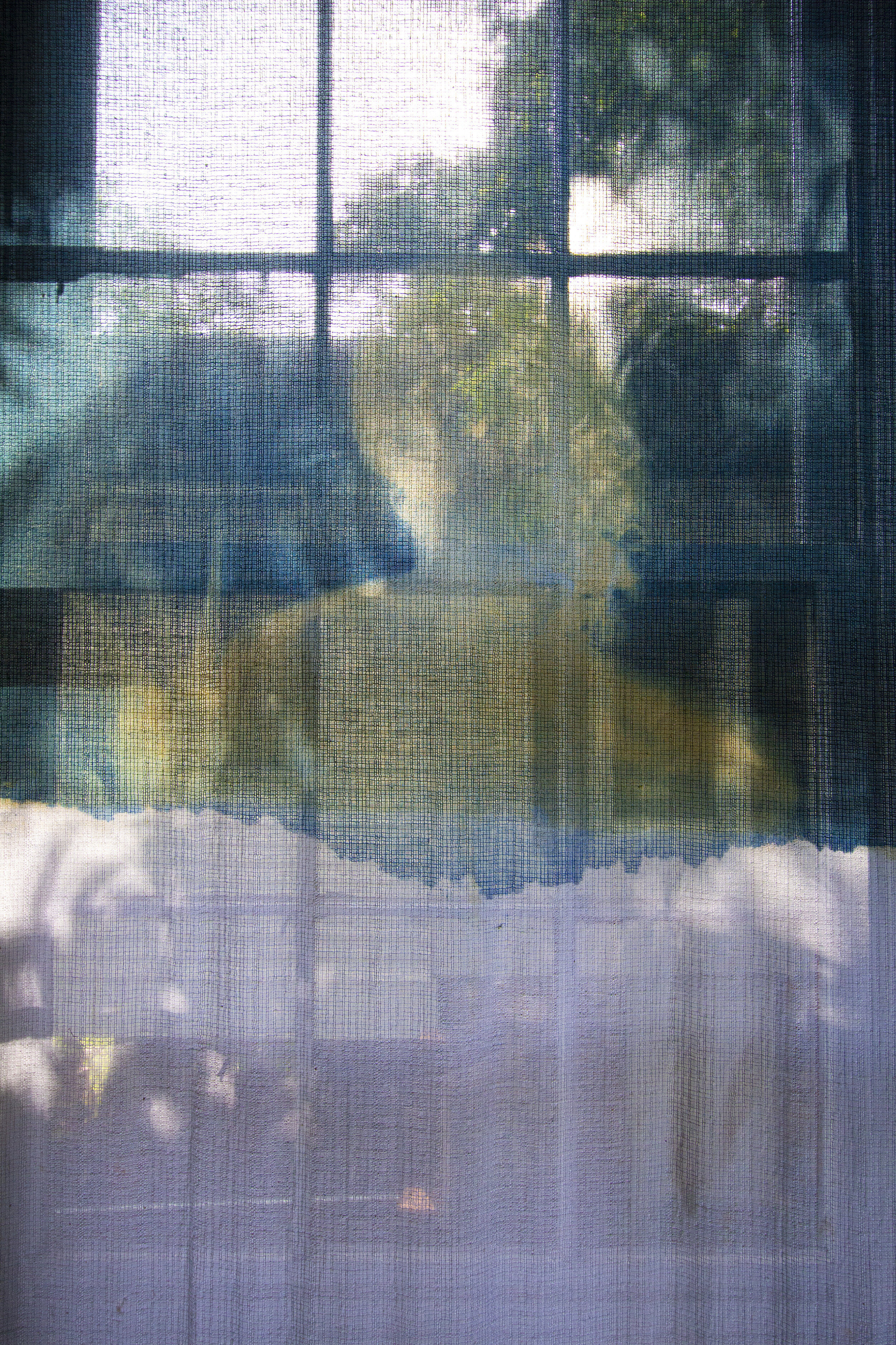 Sunrise (detail) [late afternoon], 2020, cotton curtain, cyanotype solution, curtain rod, and hardware, 55 x 84 inches