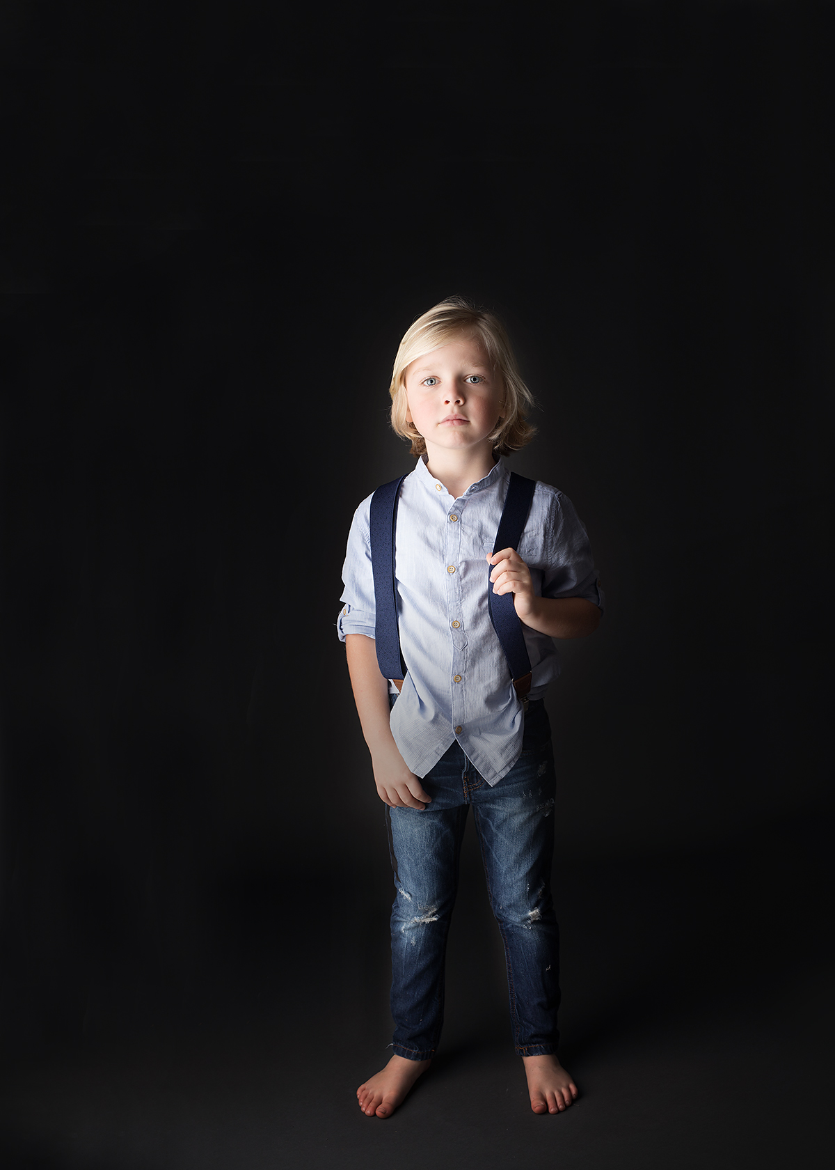 boy could be a gap model at candace hires photography studio black background session