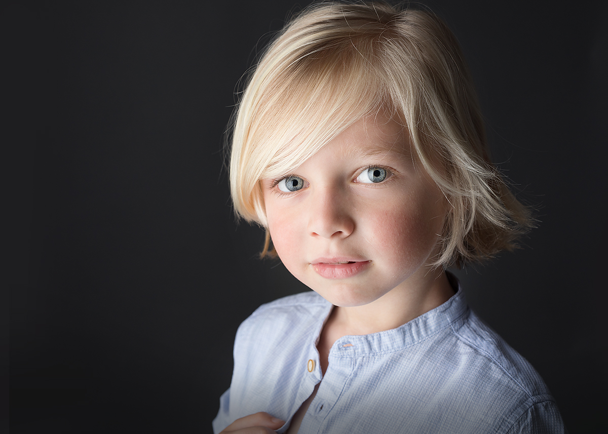 beautiful boy photographed on black background at candace hires photography st simons island ga