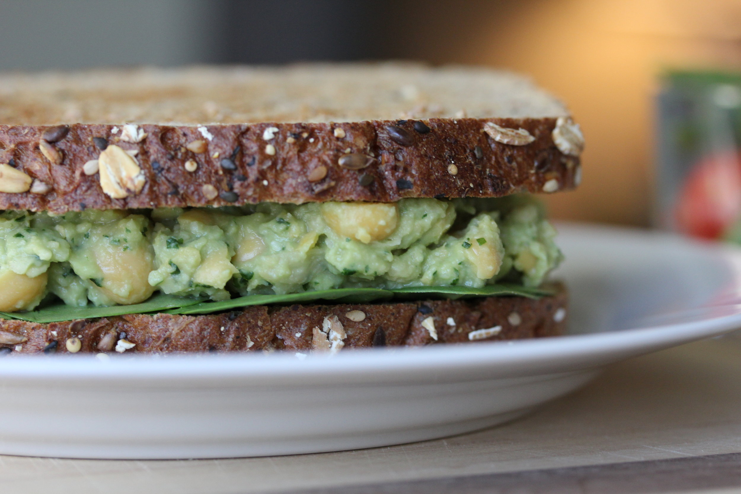 Smashed Avocado, Chickpea, &amp; Pesto Sandwiches are a delicious way to fill up on fiber!