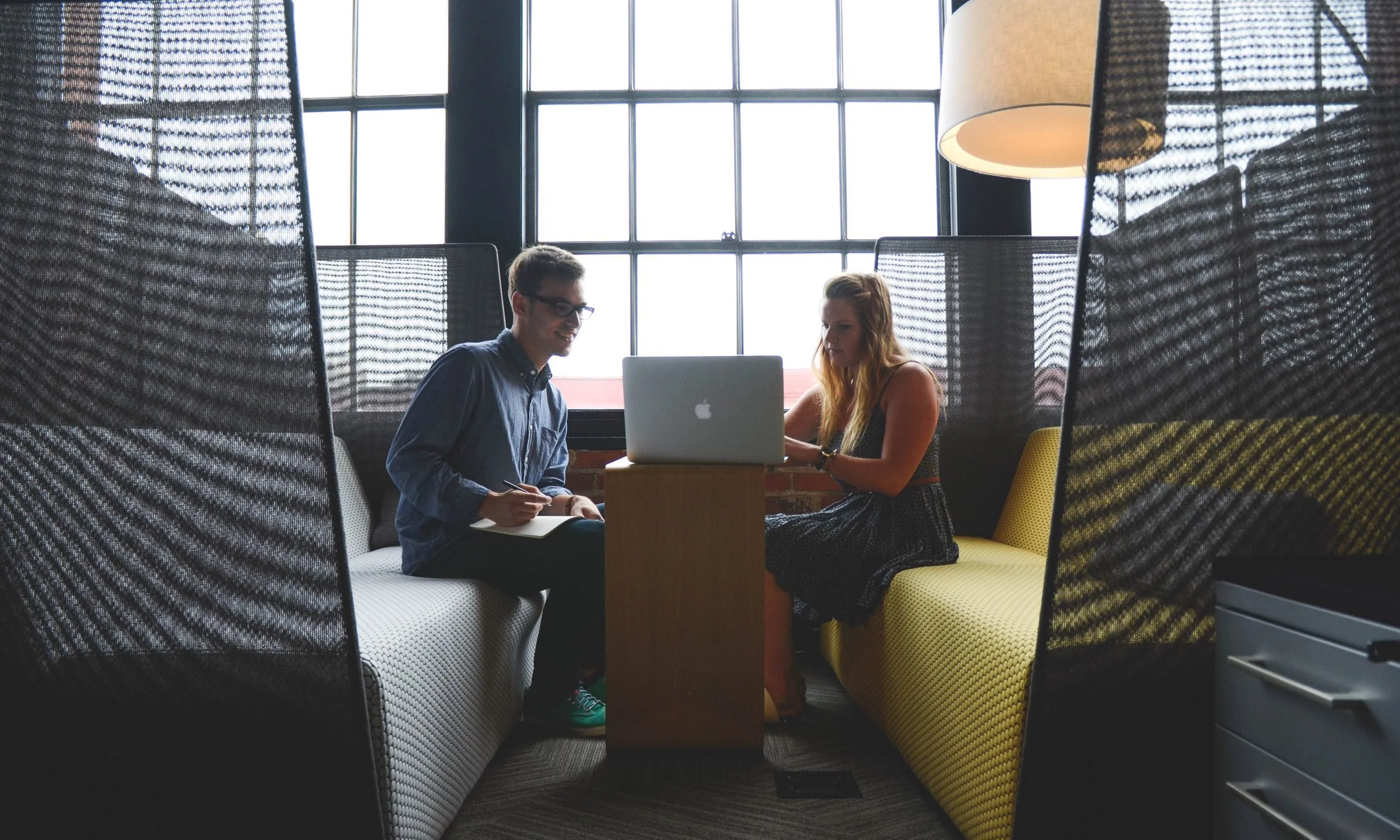 two_people_in_office_meeting.jpg