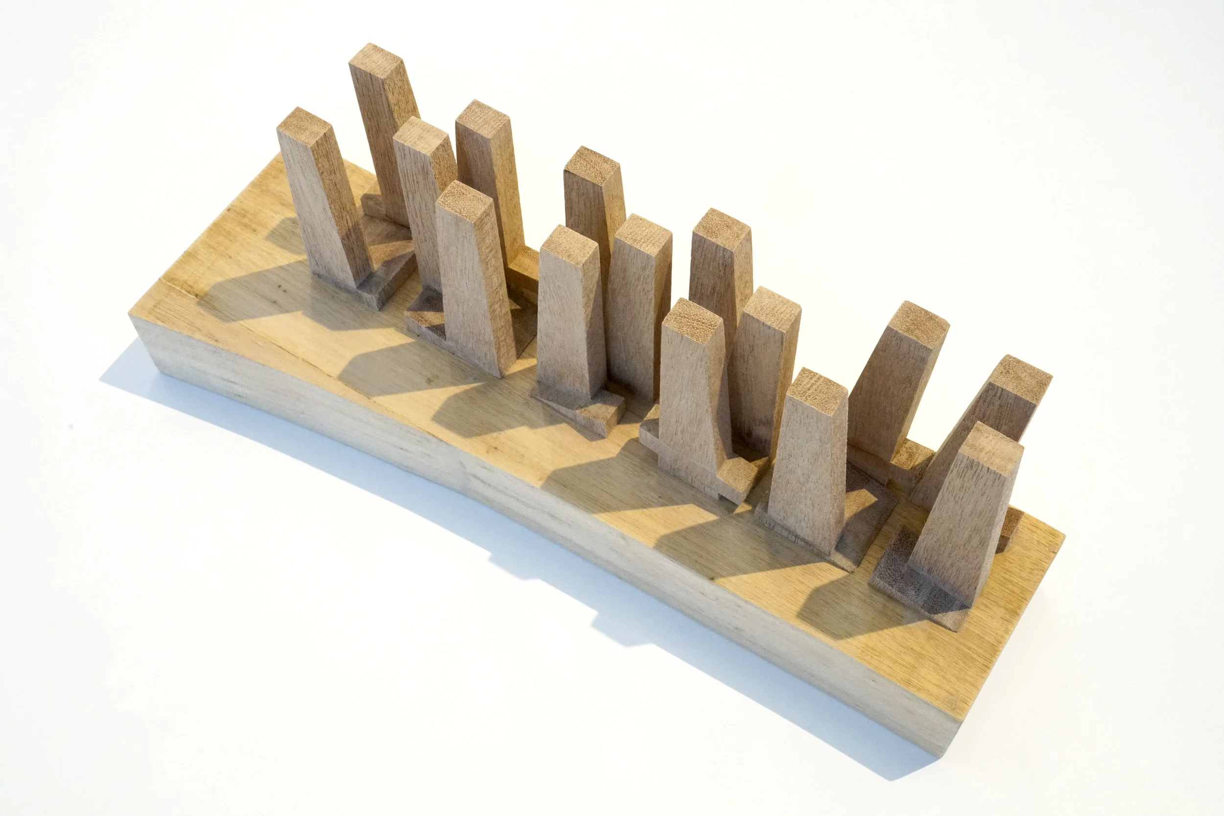 To achieve the desired density, a series of 15 tapered towers are distributed across the site. The tapered towers are organized to optimize views between the blocks and minimize overlooking between towers. The towers taper in and out to maximize views to the surrounding landscape. Each tower is 28,000 sqm and 150m tall. The base of each tower is 42m x 20m, and the top of each tower is 25m x 20m. Overtime, the surrounding city is expected to continue to grow and redevelop.