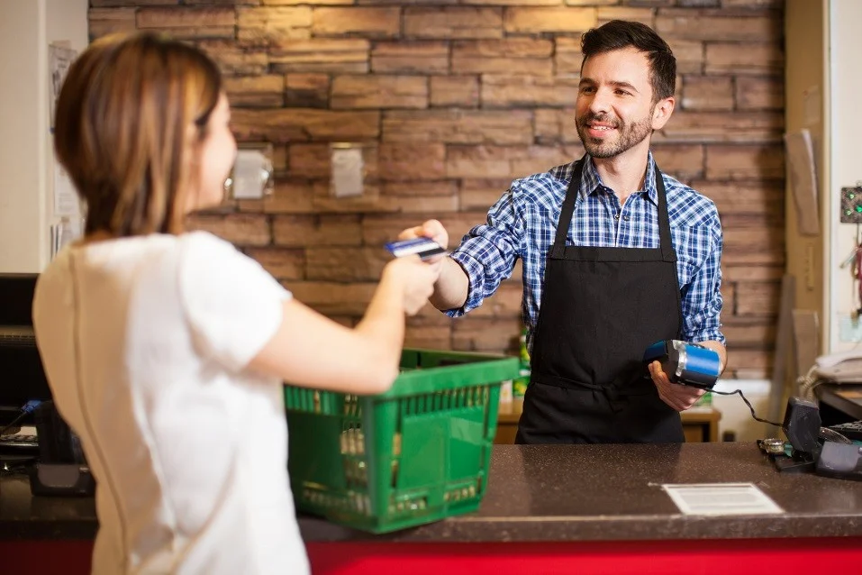 Cashier-receiving-a-credit-card-payment.jpg