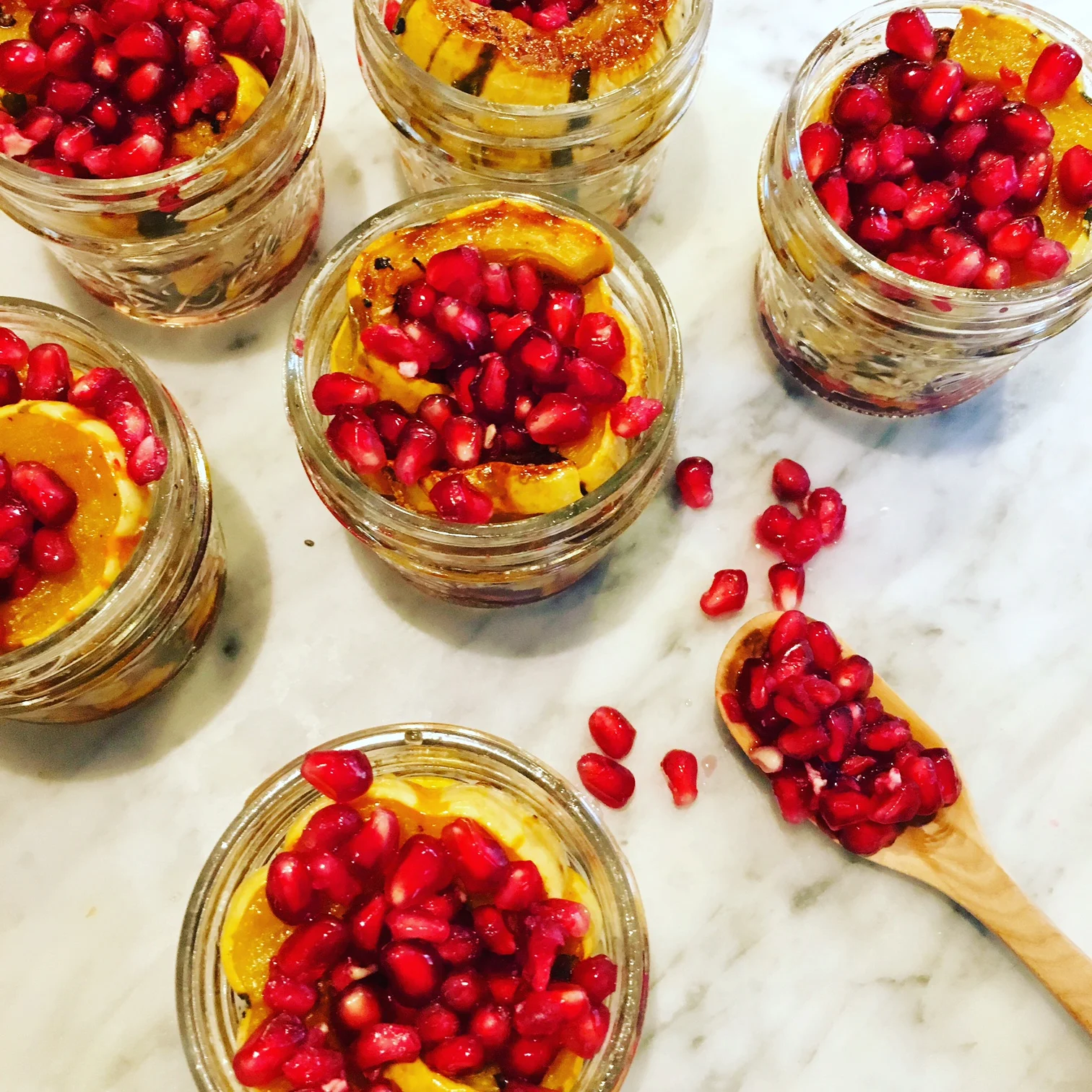 Mini Mason Jars filled with Delicata Squash, Maple Syrup & Pomegranate Seeds